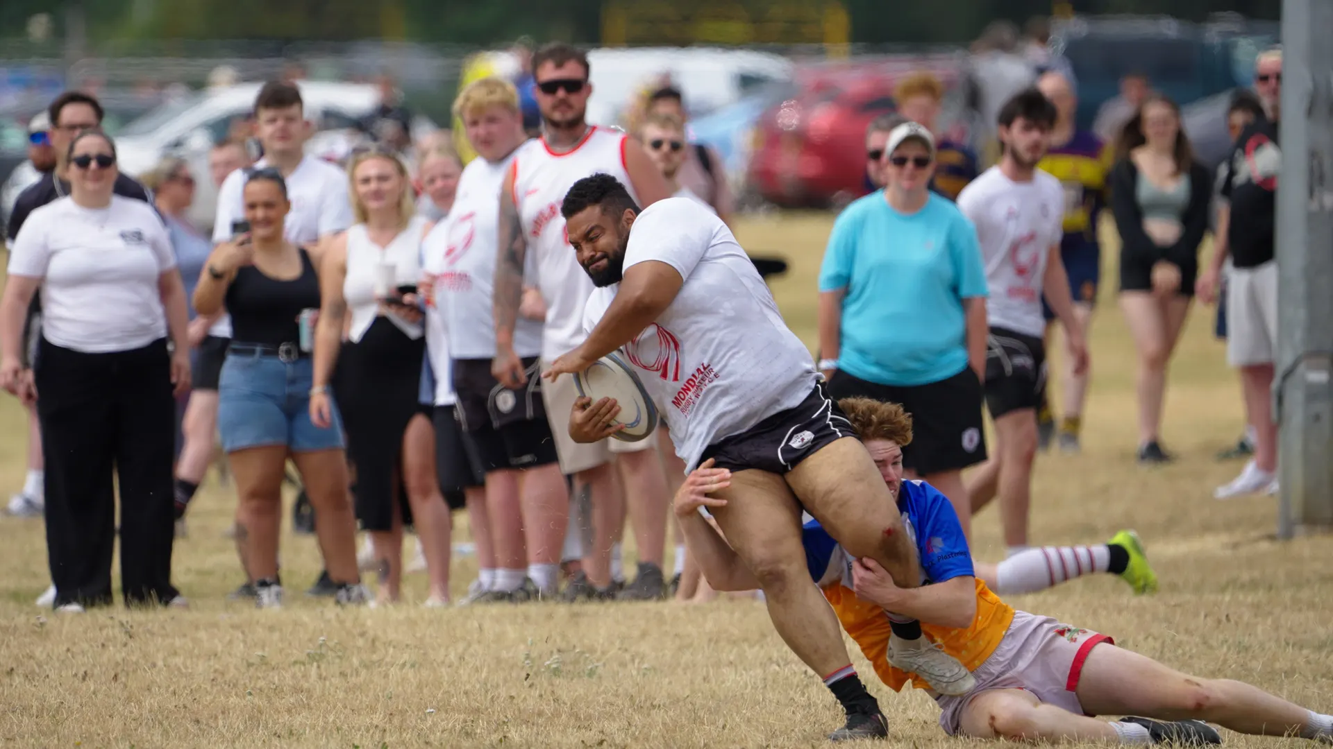 Rugby tackle in front of spectators at Hamplified