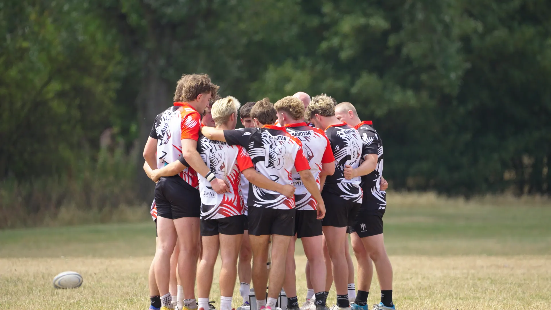 TR7 players gathered in a team huddle