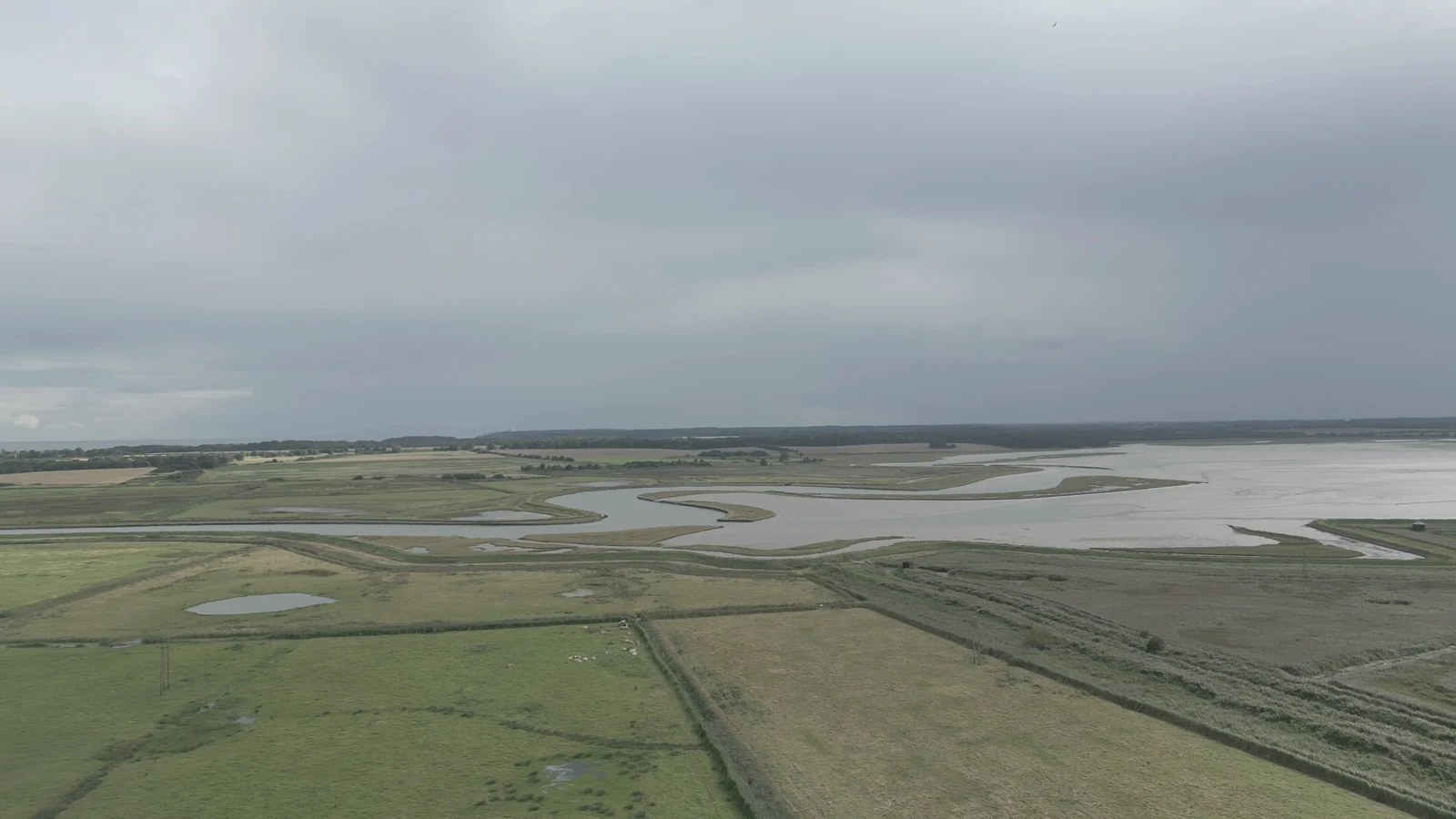 Film still: The River Deben and surrounding marshes