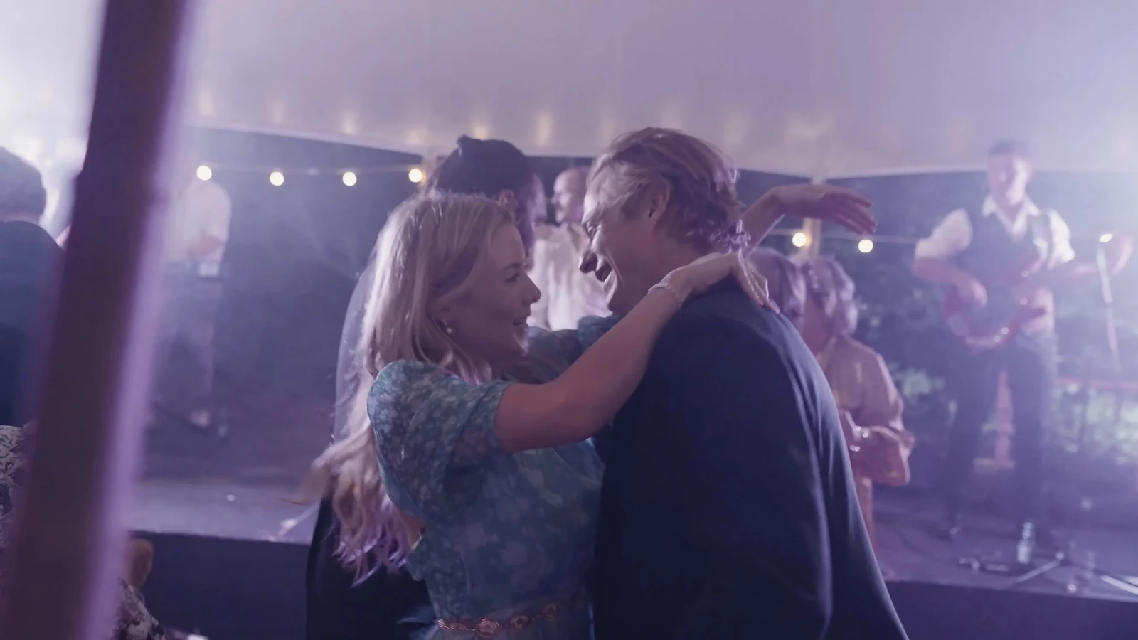 Film still: Harriet and Luke together on the dance floor