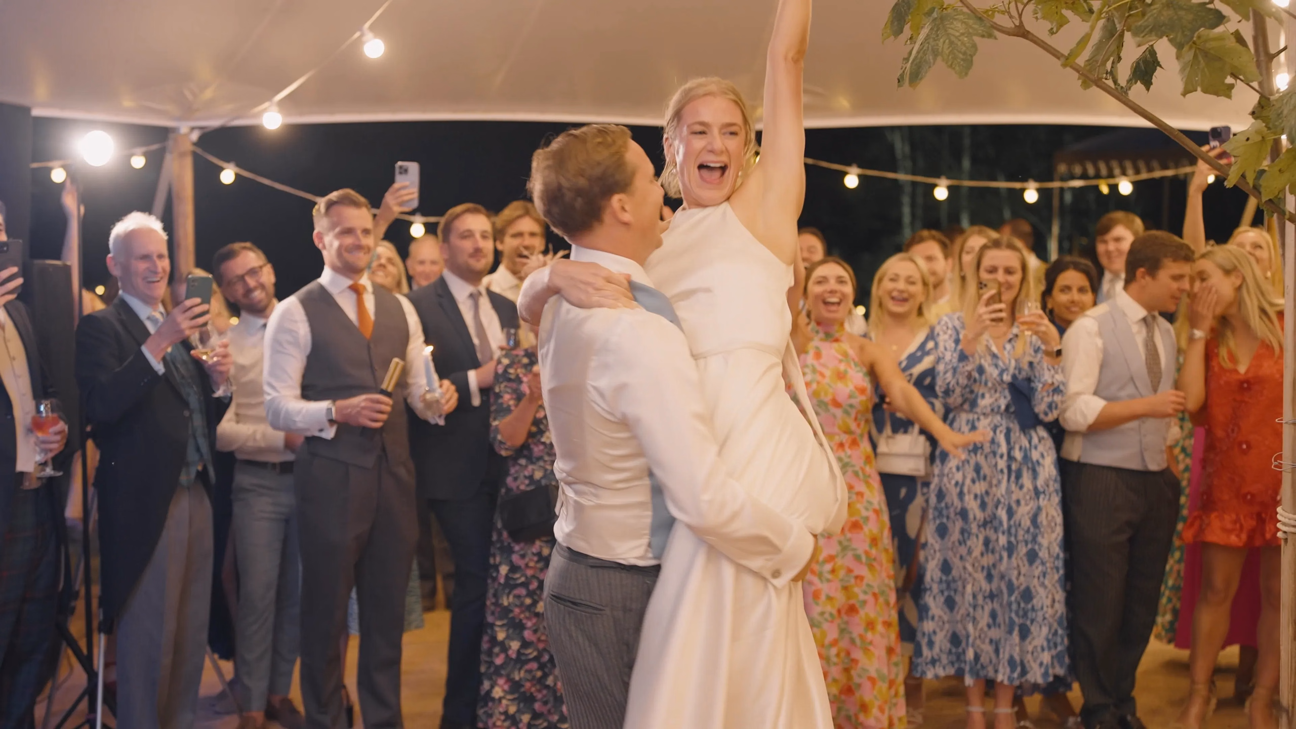 Film still: Harriet and Luke celebrating on the dance floor