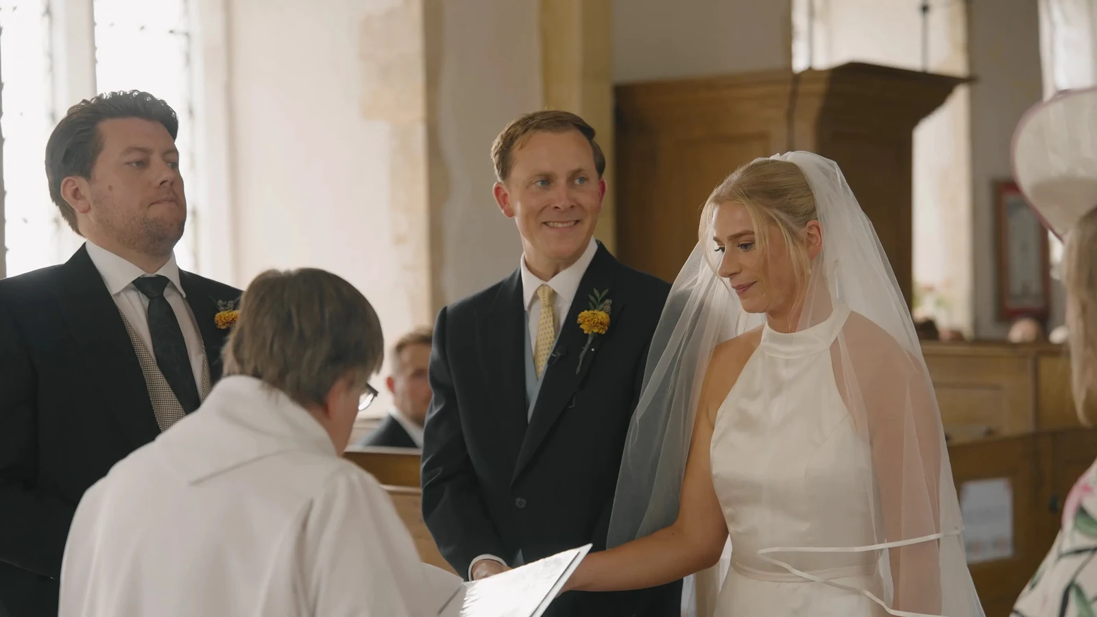 Film still: Harriet and Luke during their church ceremony