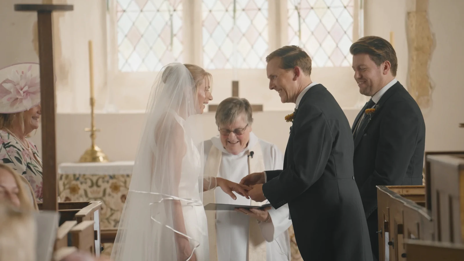 Film still: Harriet and Luke exchanging rings