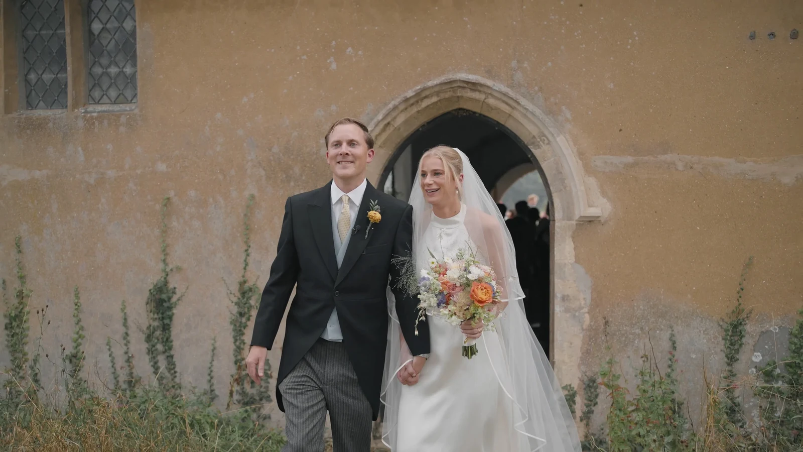 Film still: Harriet and Luke outside All Saints Church