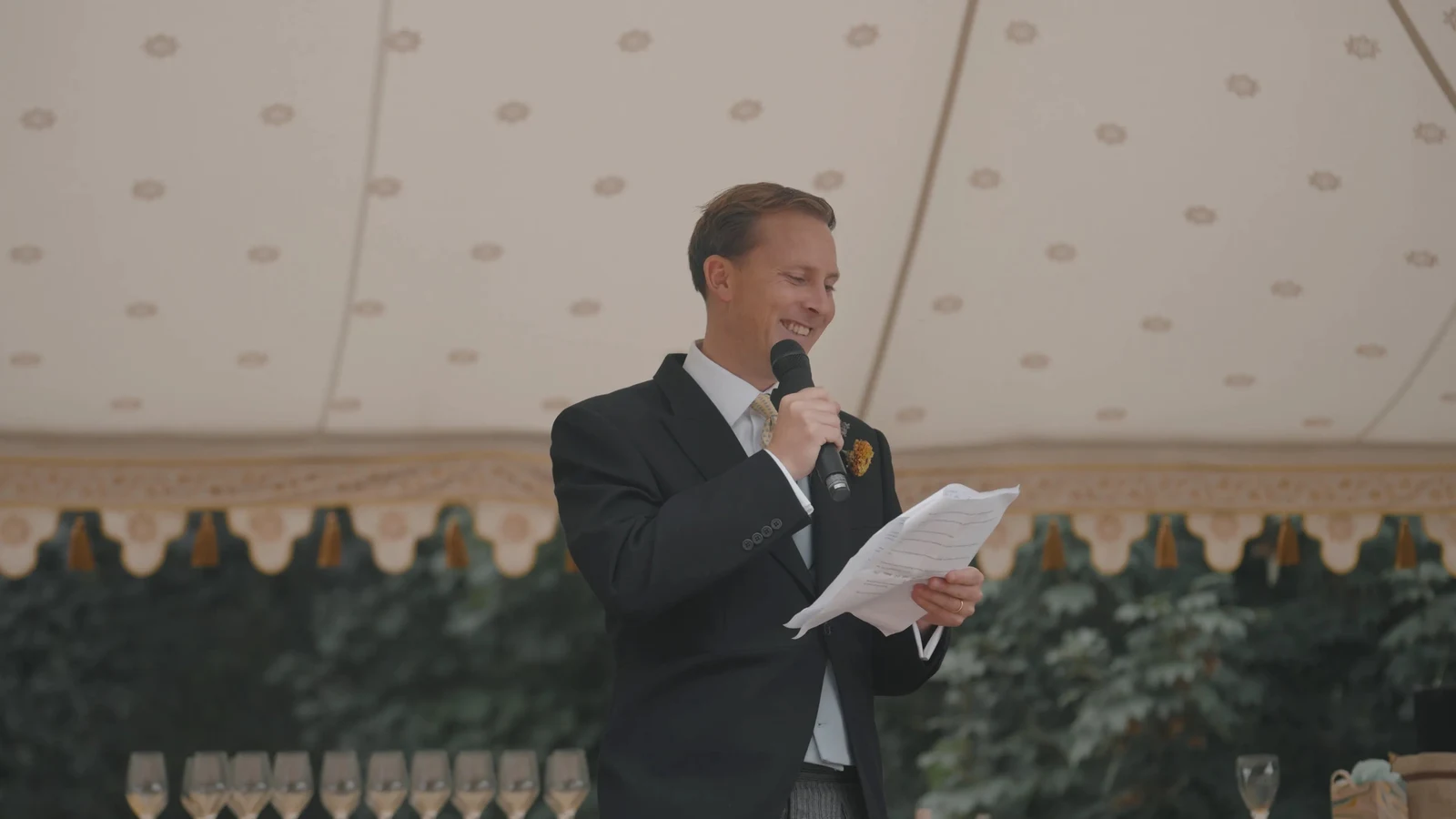 Film still: Luke delivering his wedding speech