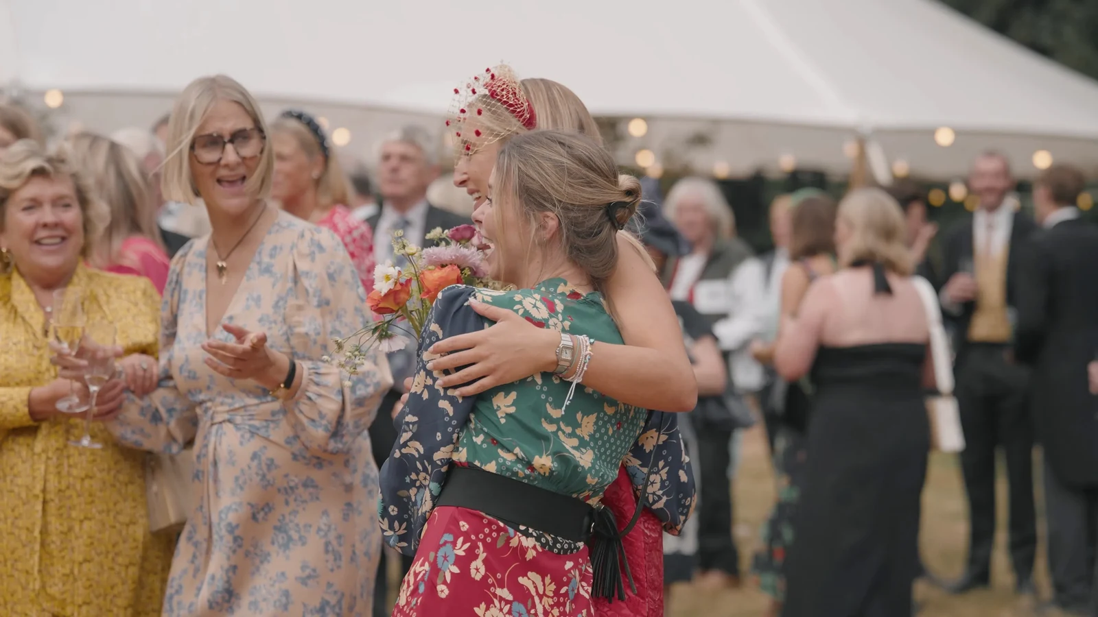 Film still: Guests enjoying the wedding reception