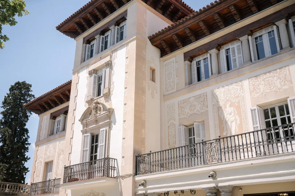 The balconies and pale stone facade of Finca Mas Solers