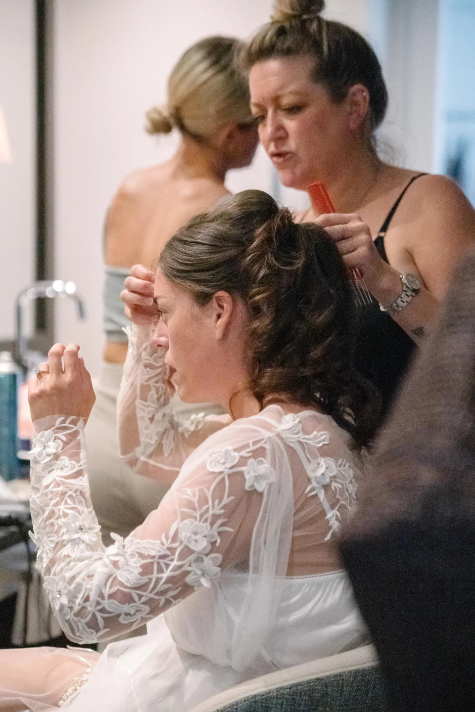 Ellie having her makeup finished on the wedding morning