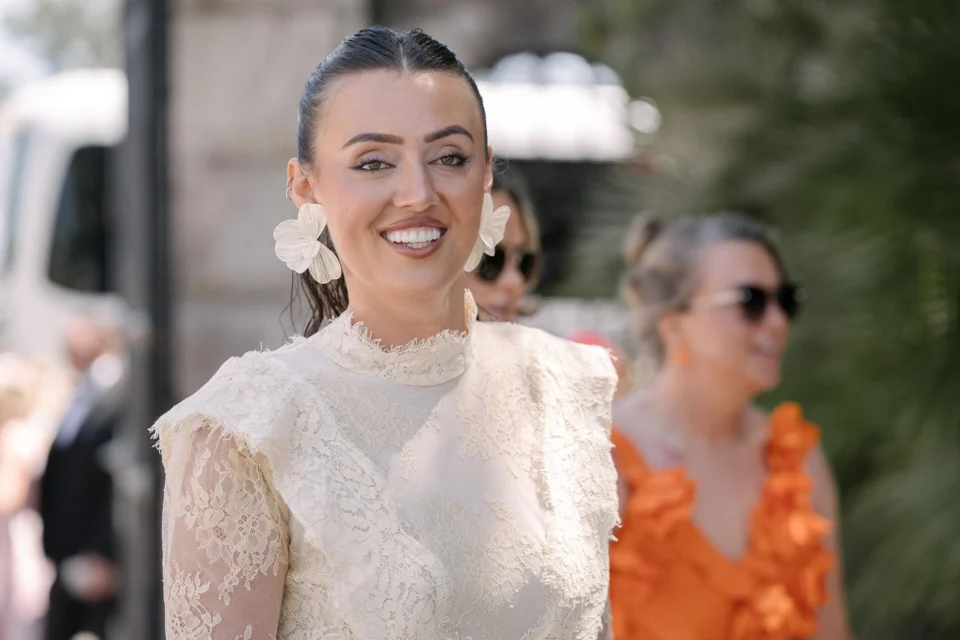 Ellie smiling outside before the ceremony