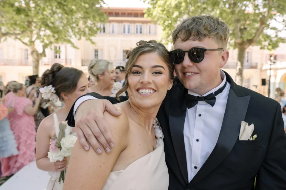 Ellie smiling with a wedding guest after the ceremony
