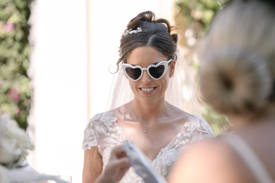 Ellie wearing heart-shaped sunglasses at the reception