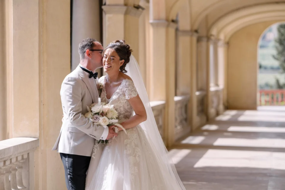 Ellie and Ernie laughing together in the shaded colonnade