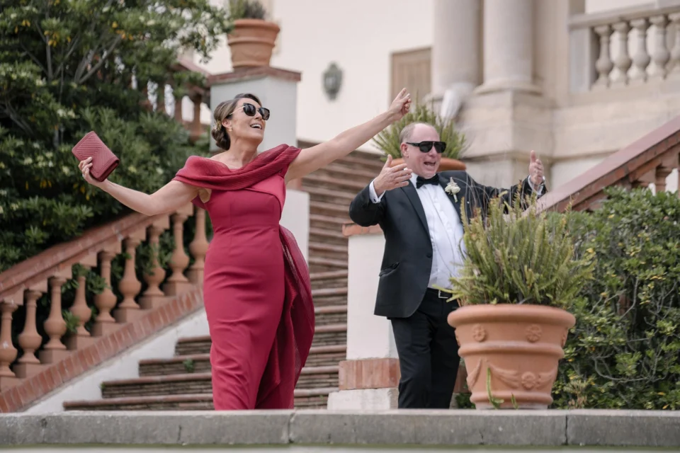 Wedding guests celebrating on the terrace steps