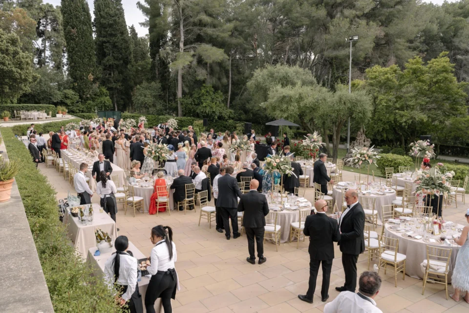 A wide view of guests and tables at the garden reception