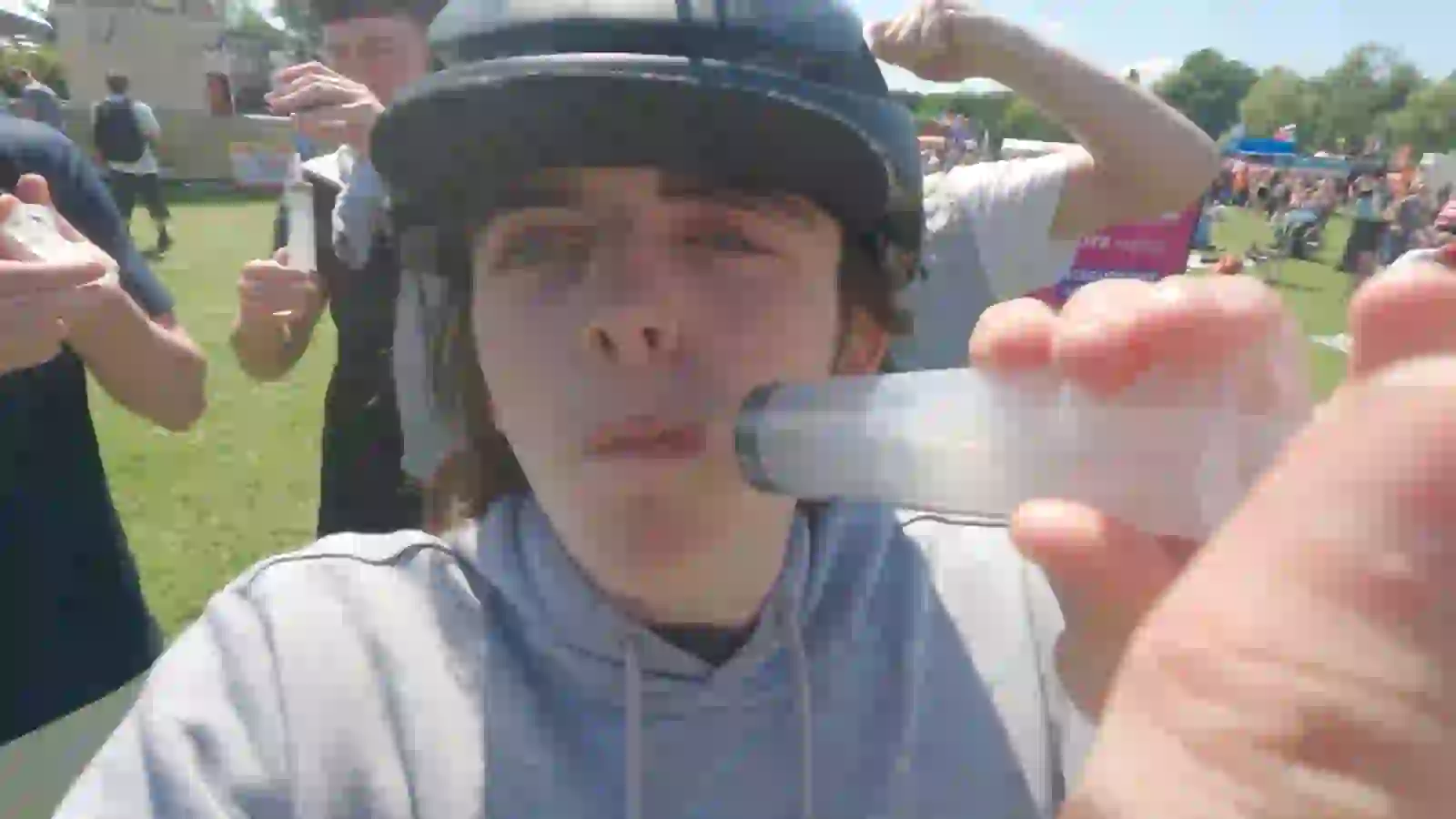 A festival-goer wearing the Jelly Cam helmet rig