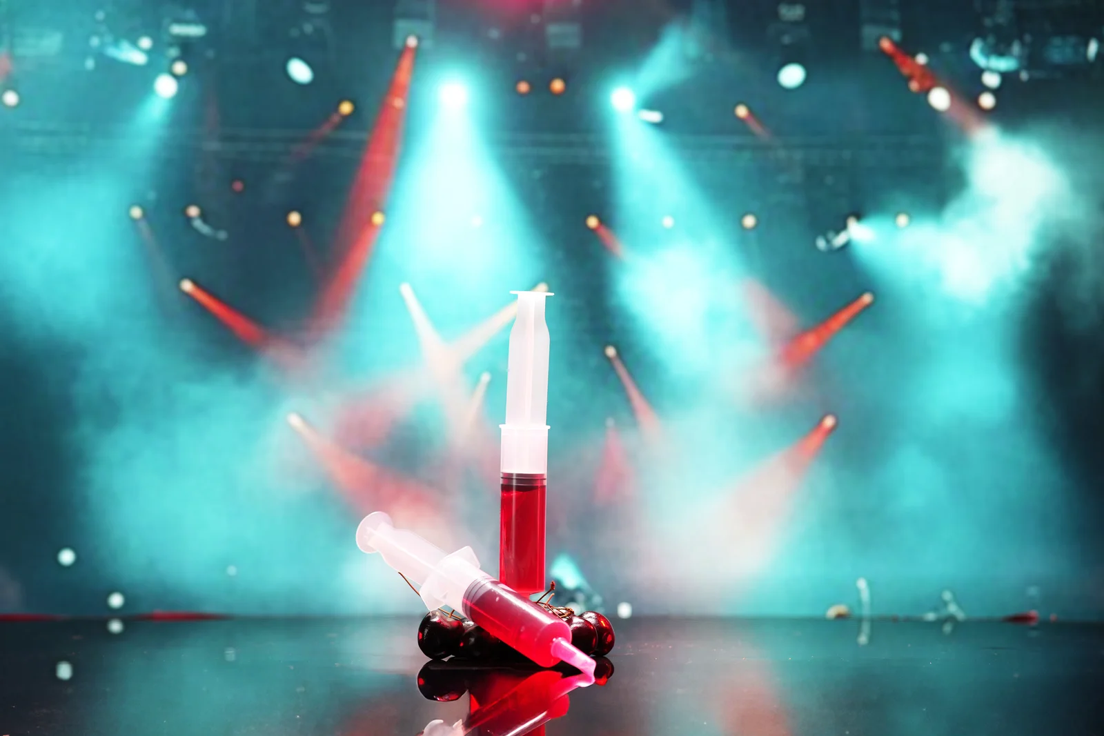 Jellyshotz Wild Cherry Vodka — standalone syringes under stage lighting