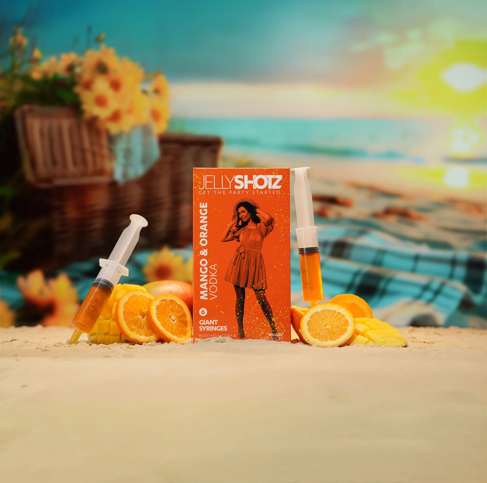 Jellyshotz Mango & Orange Vodka — large pack and syringes against a tropical sunset