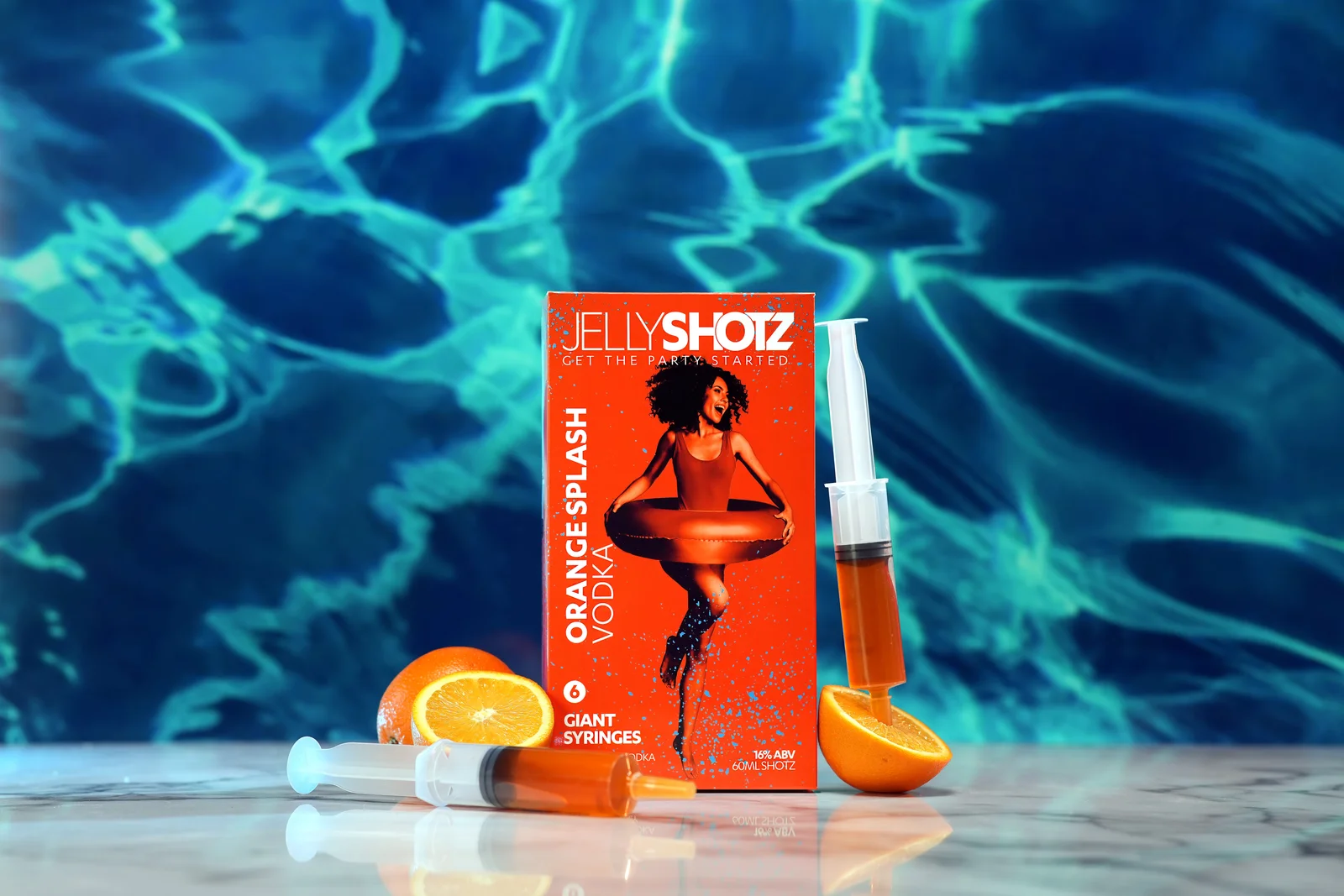 Jellyshotz Orange Splash Vodka — six-syringe pack with oranges against a pool backdrop