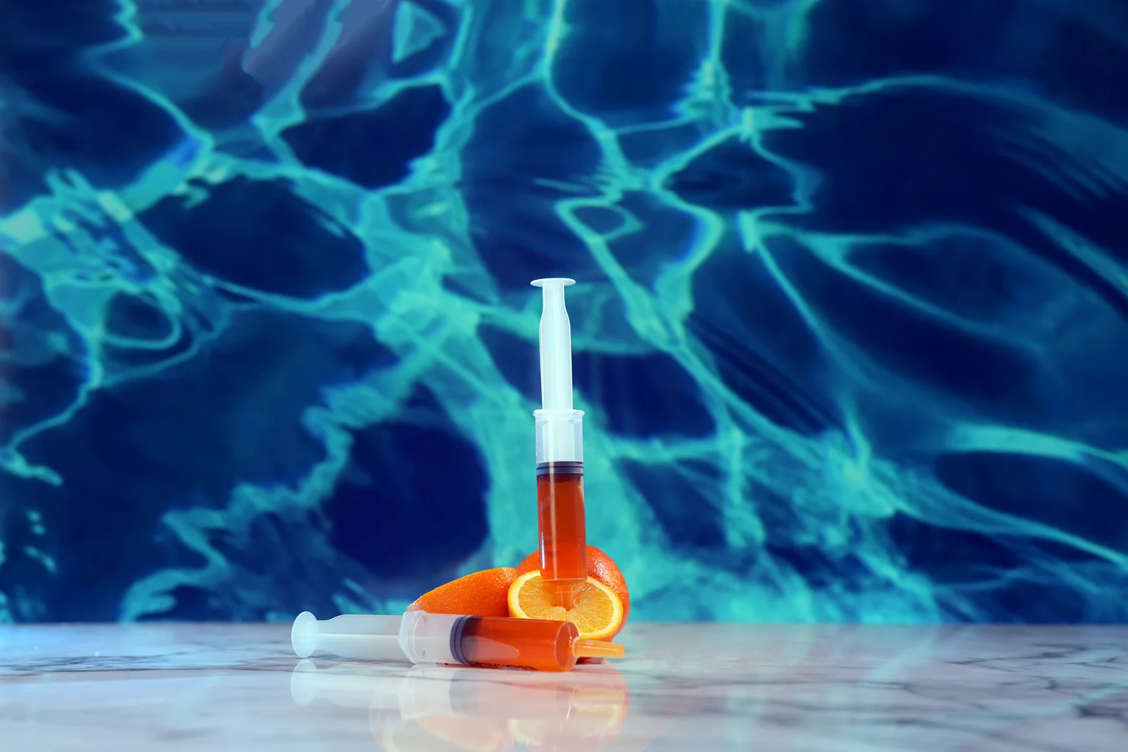 Jellyshotz Orange Splash Vodka — standalone syringes arranged with orange slices