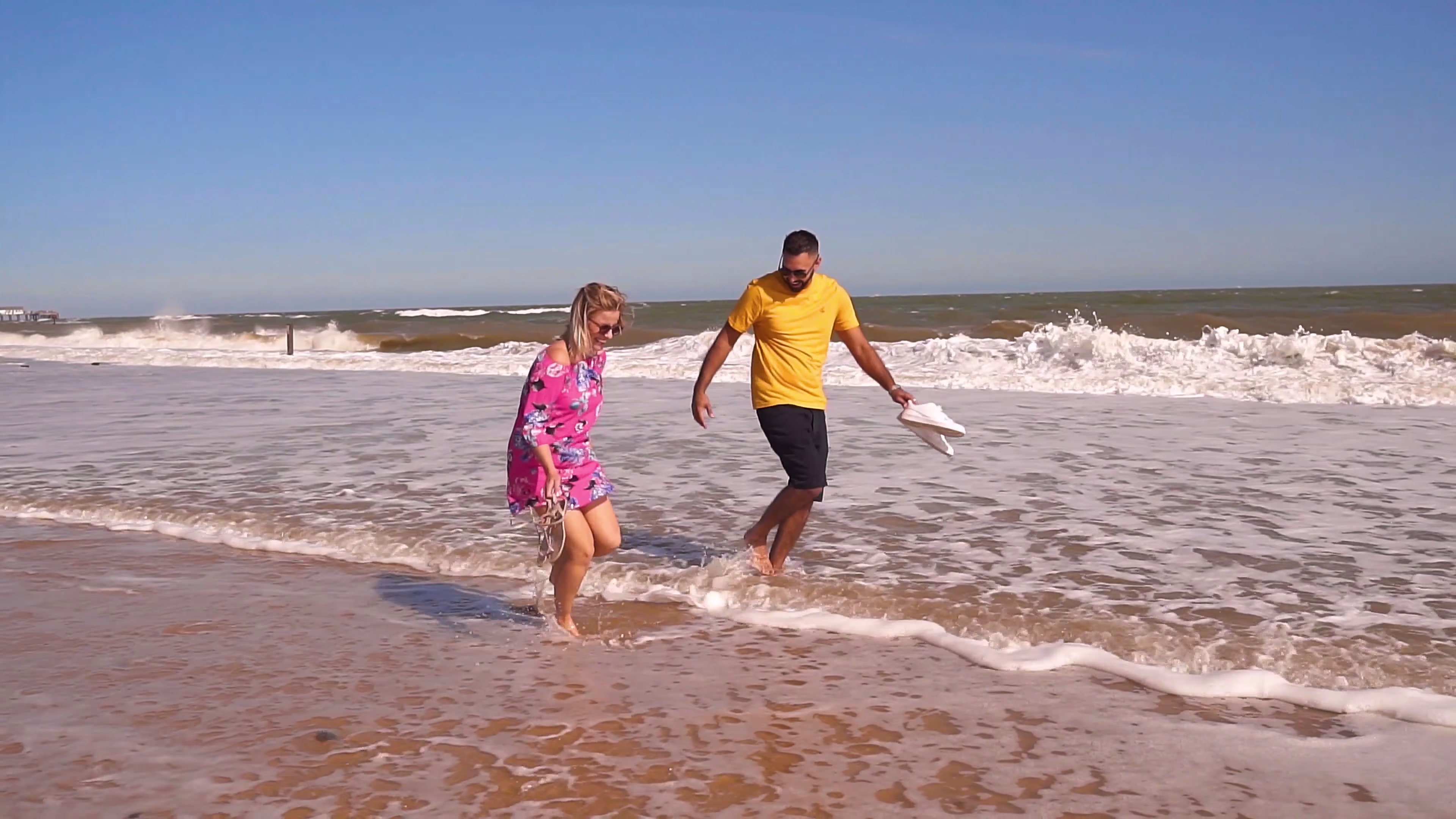 Jake and Lisa running through the sea together