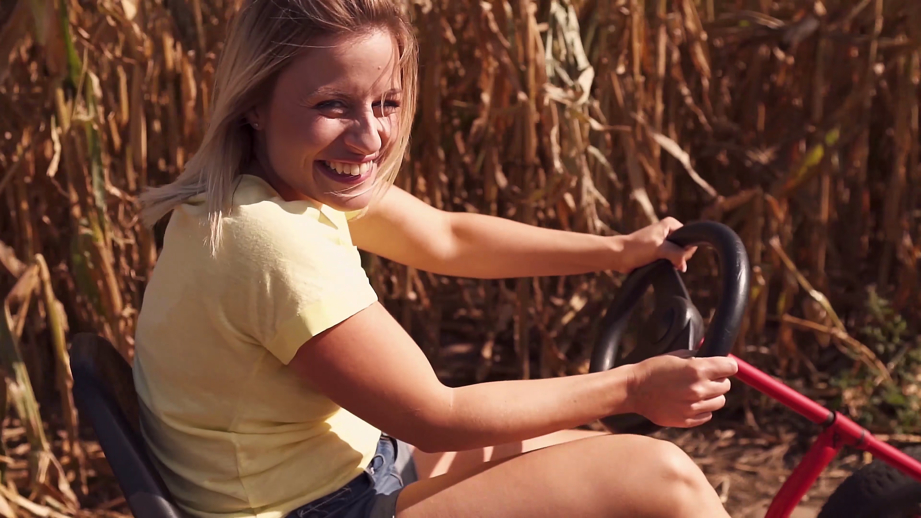 Lisa smiling while driving a go-kart