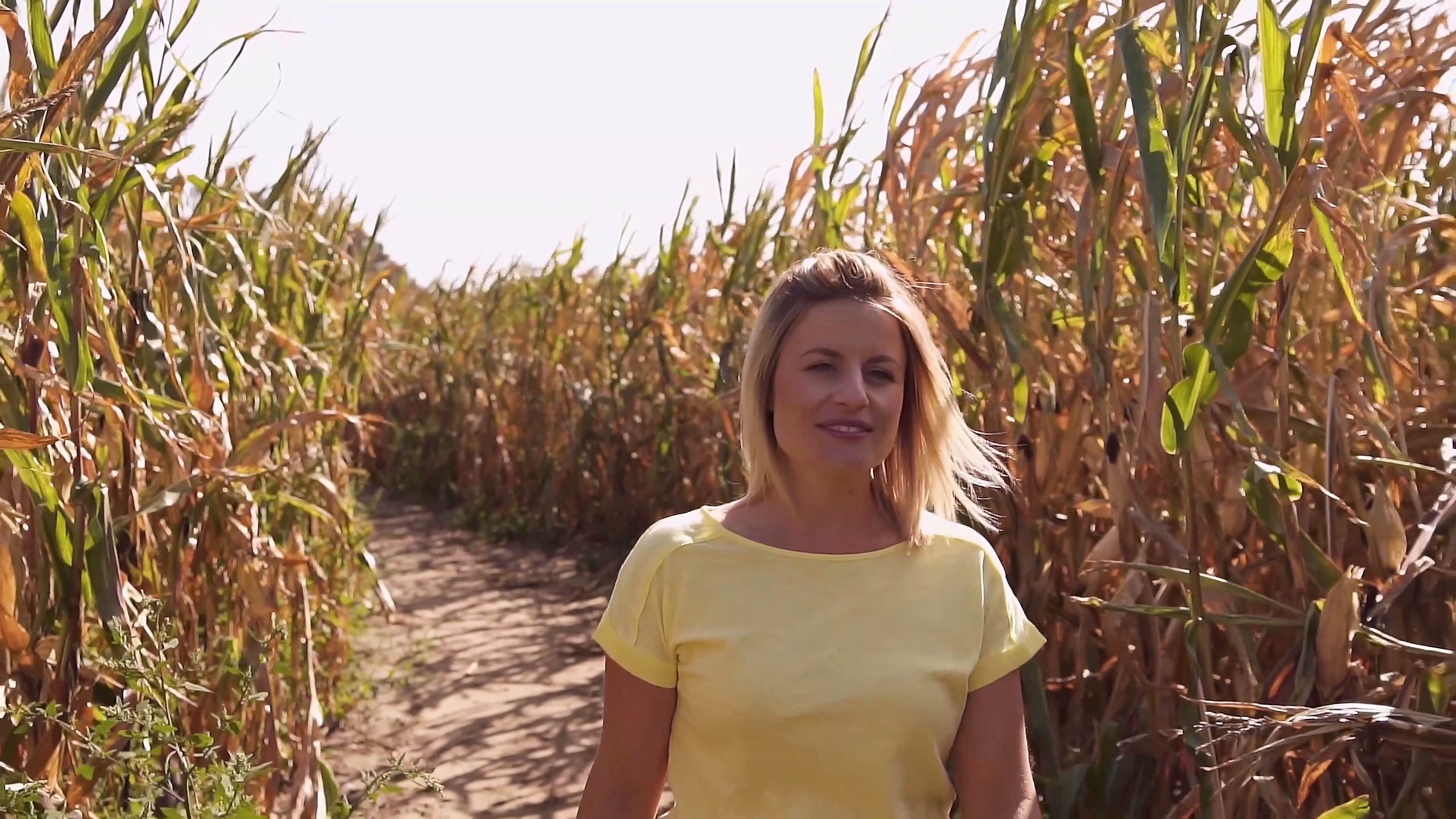 Lisa smiling inside the maize maze