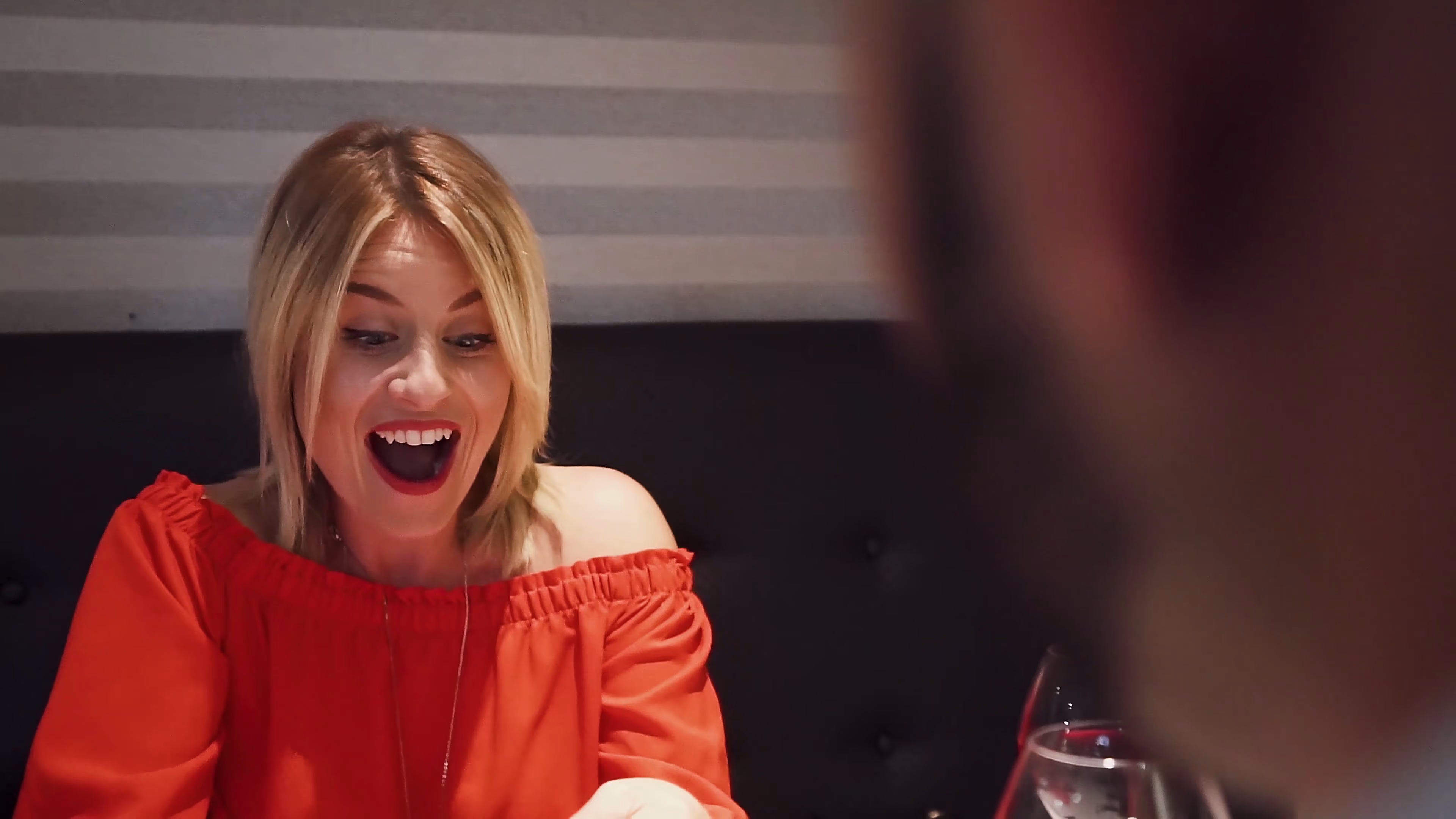 Lisa reacting with surprise during the proposal sequence