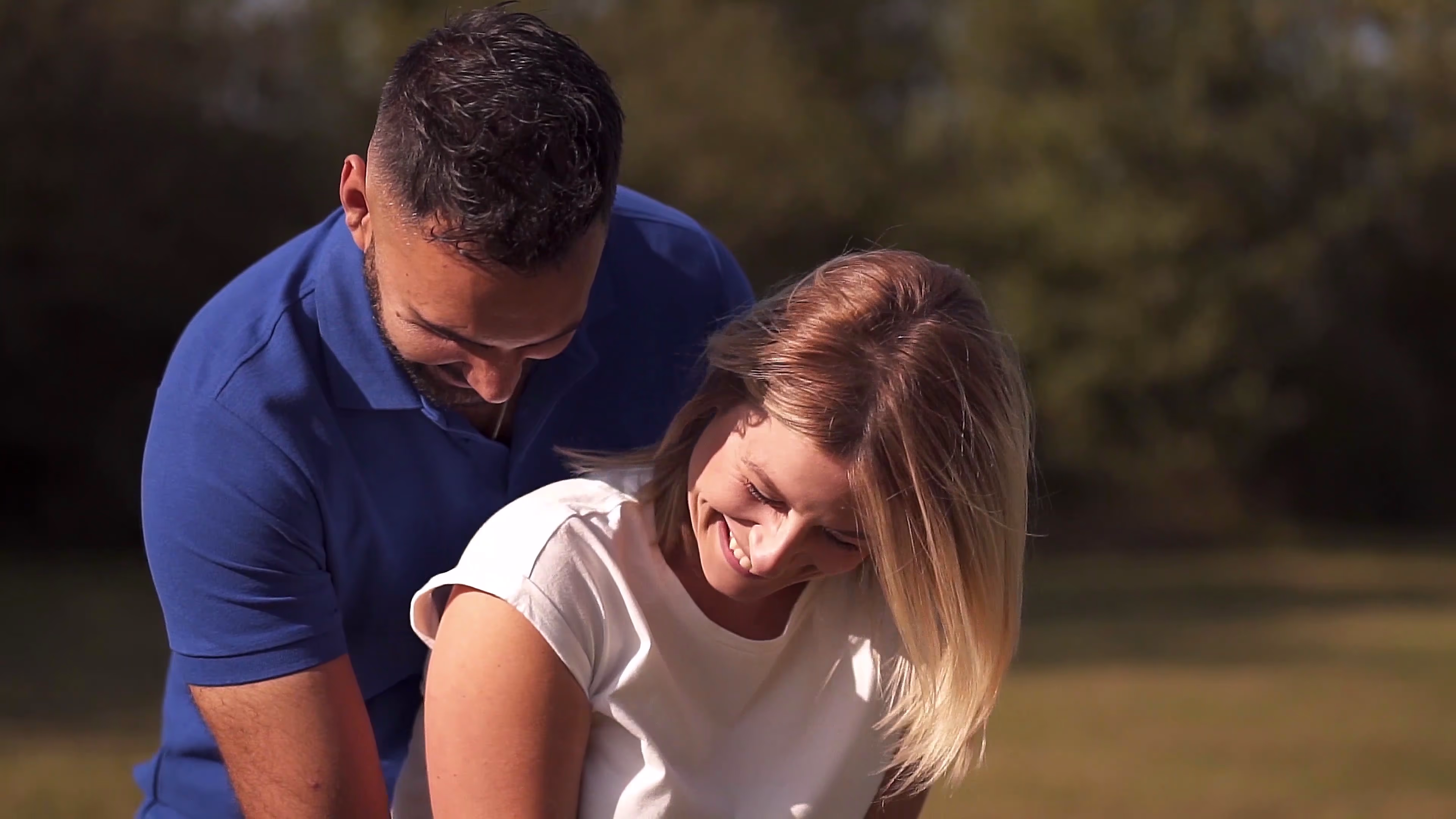 Jake and Lisa laughing together in the park