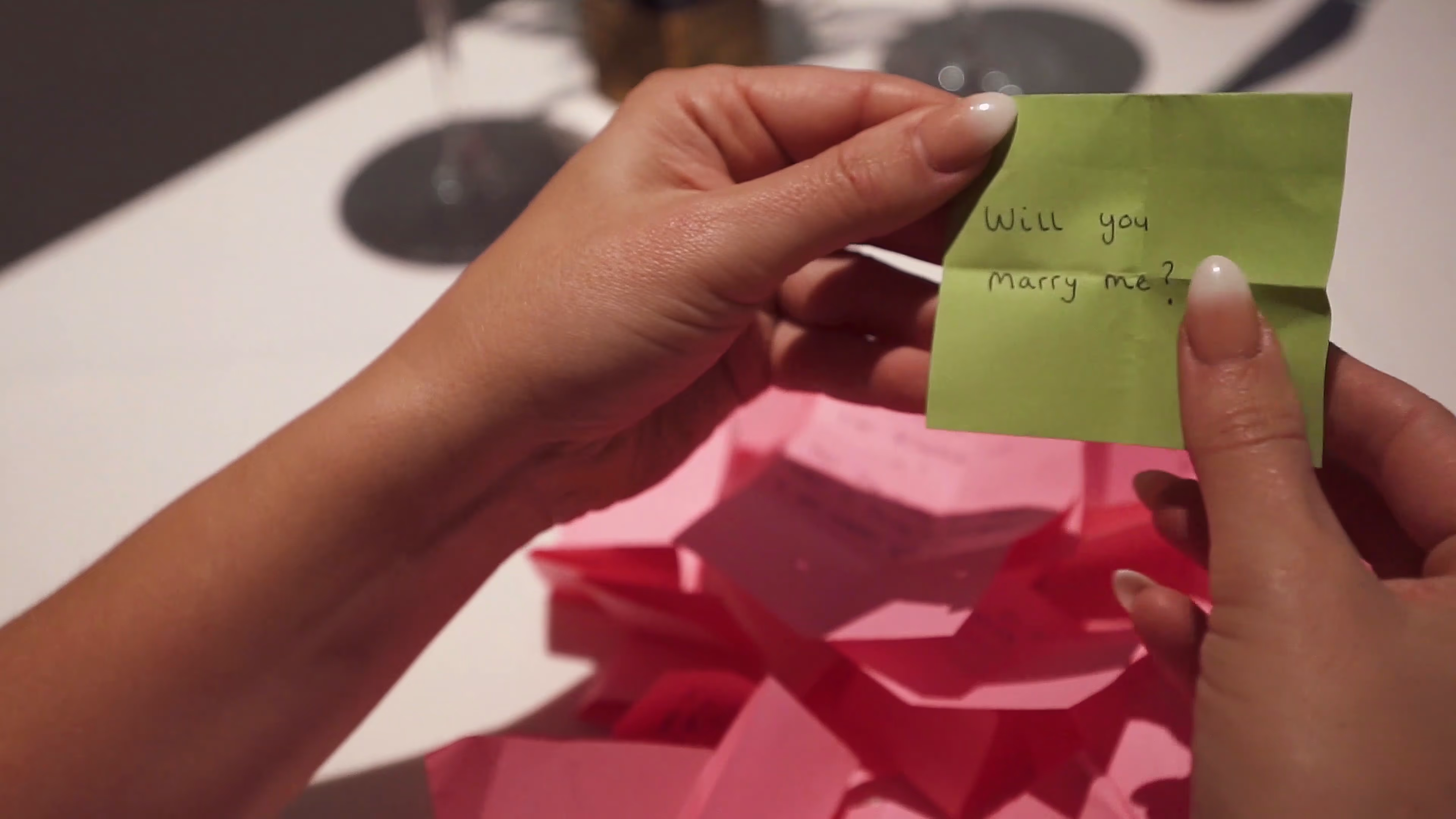 A handwritten note revealing the proposal in King of the World