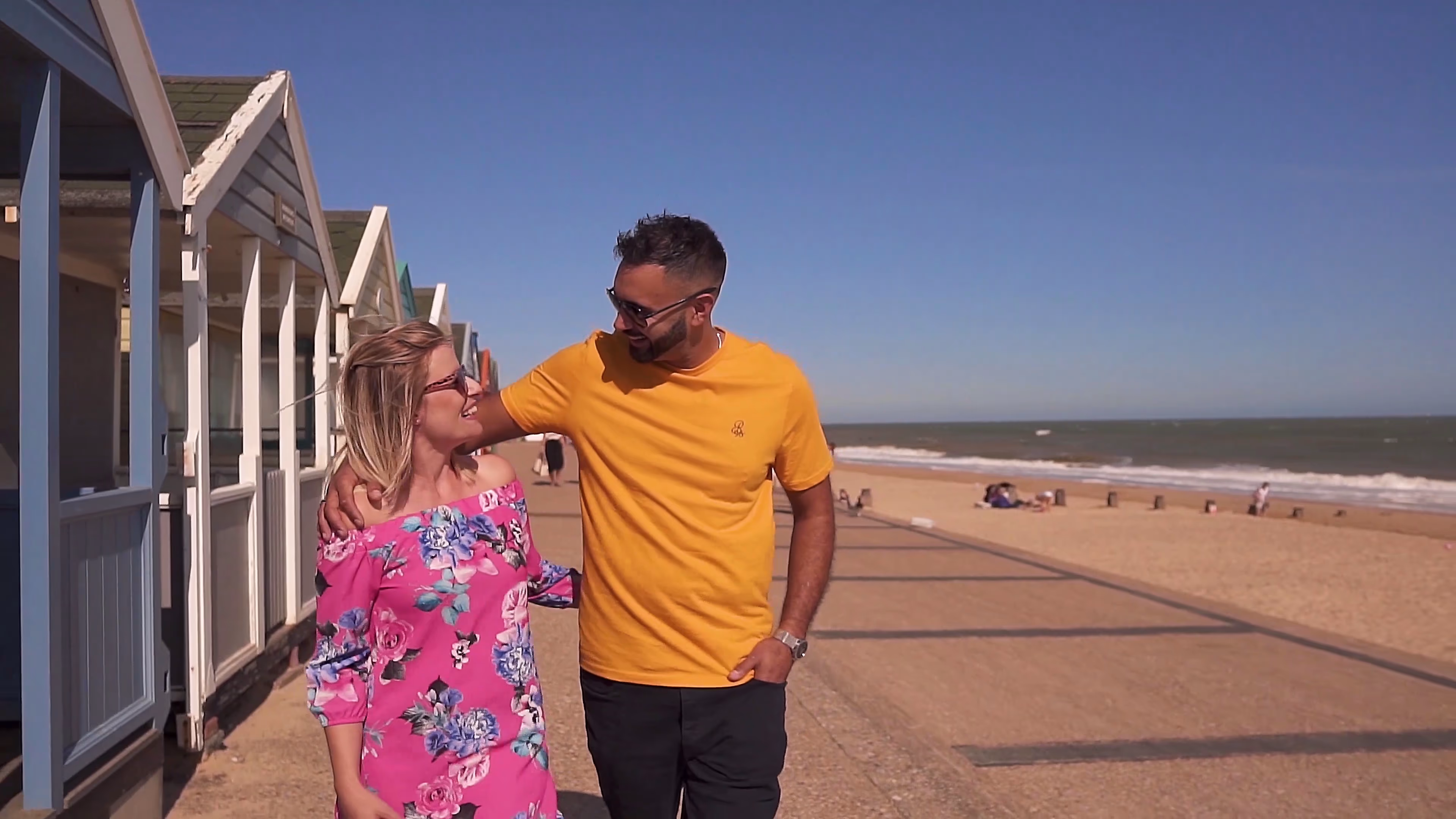 Jake and Lisa walking together along the Southwold promenade