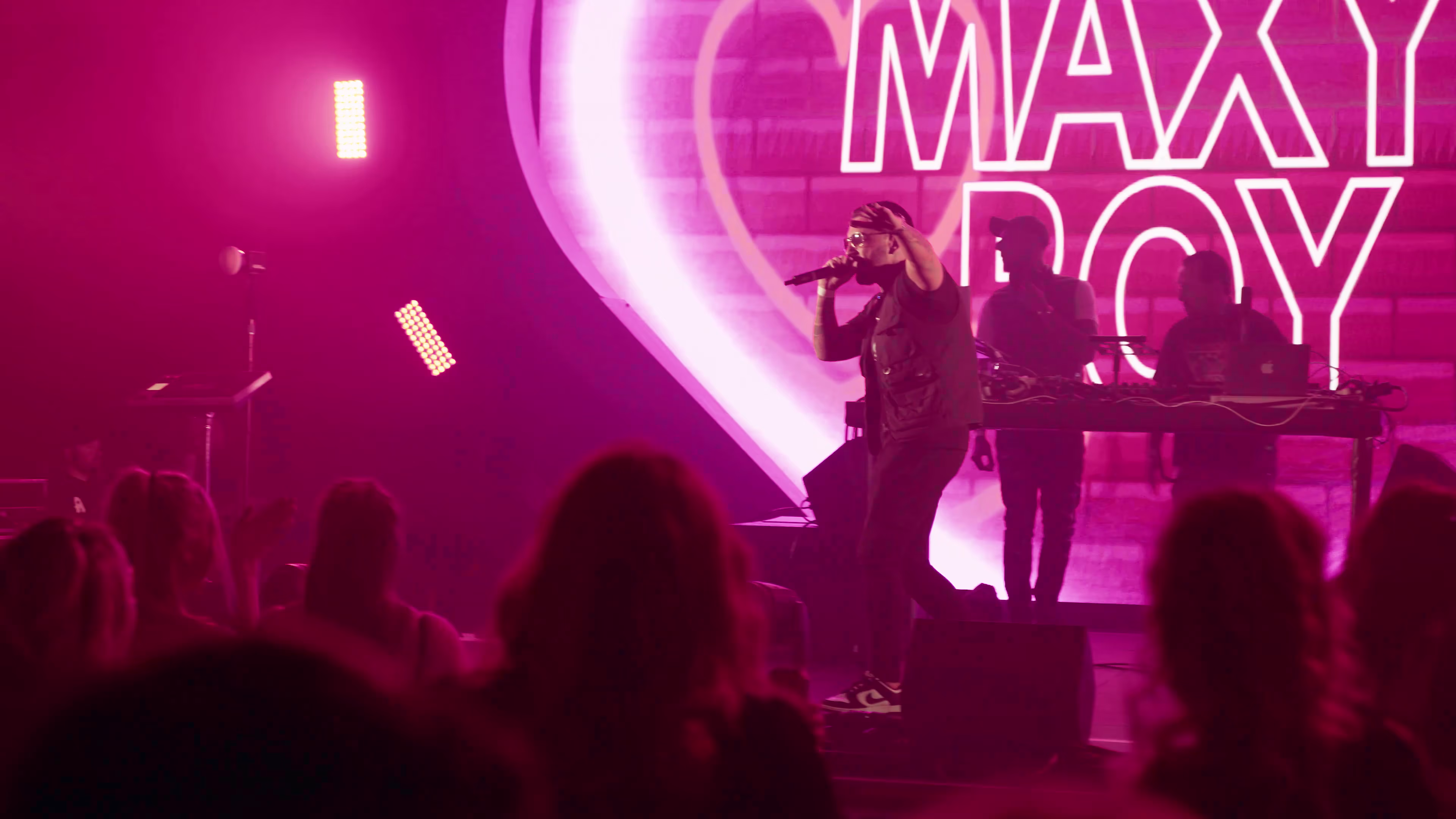 Maxy Boy on stage in front of the Show Me Love crowd