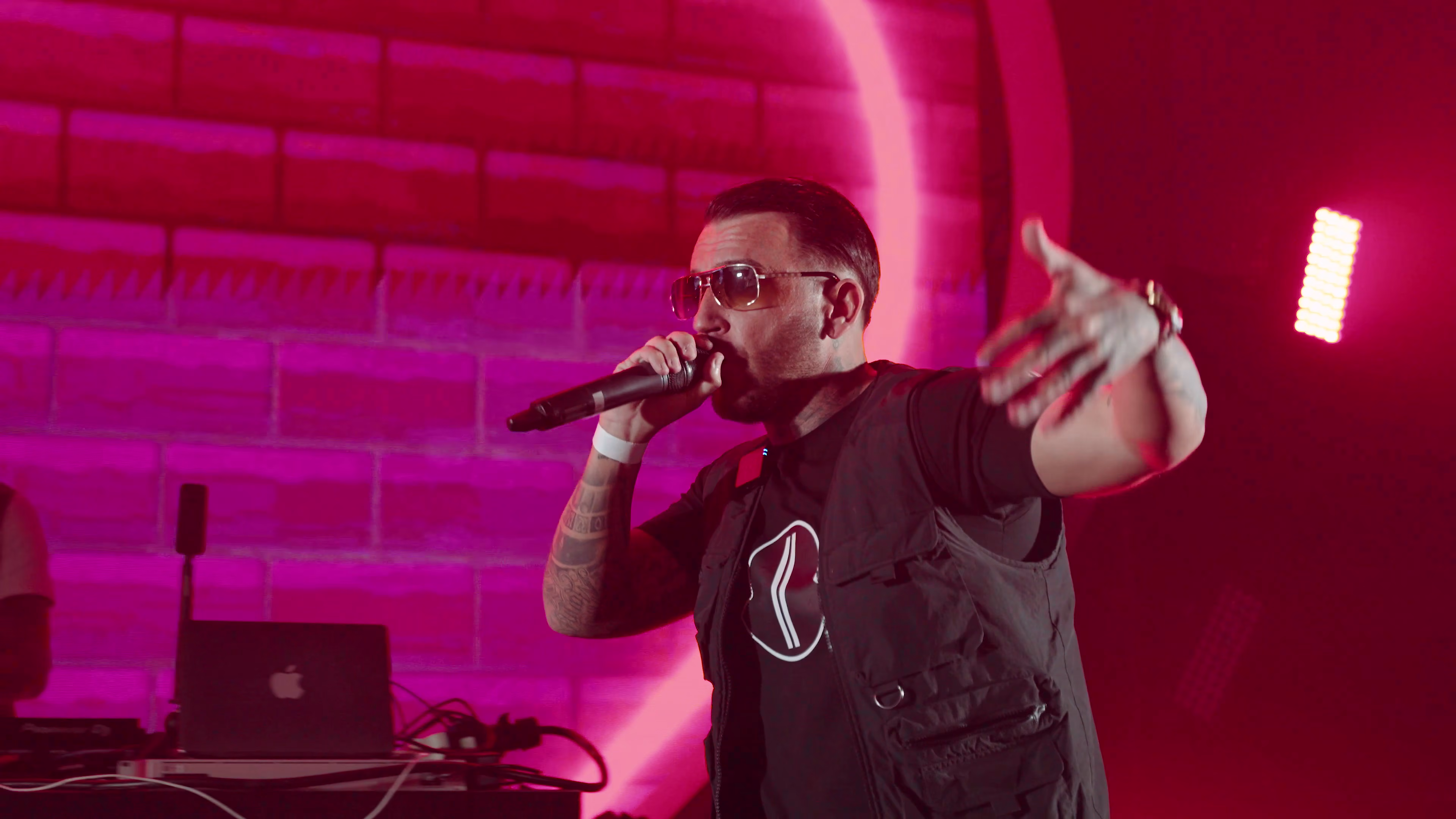 Maxy Boy holding the microphone during the Show Me Love performance