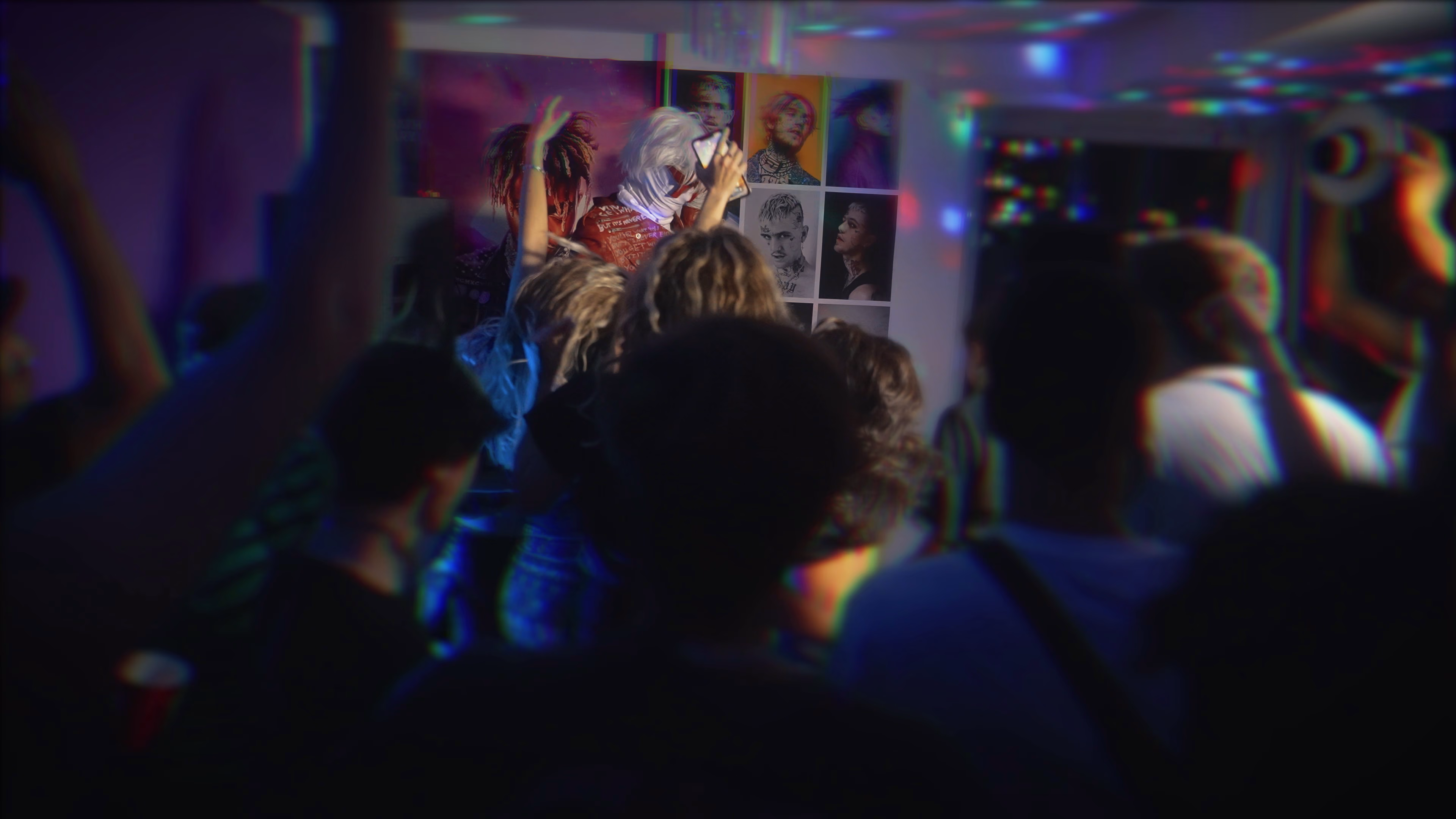 Wide view of guests surrounding Mystery Man during the shoot