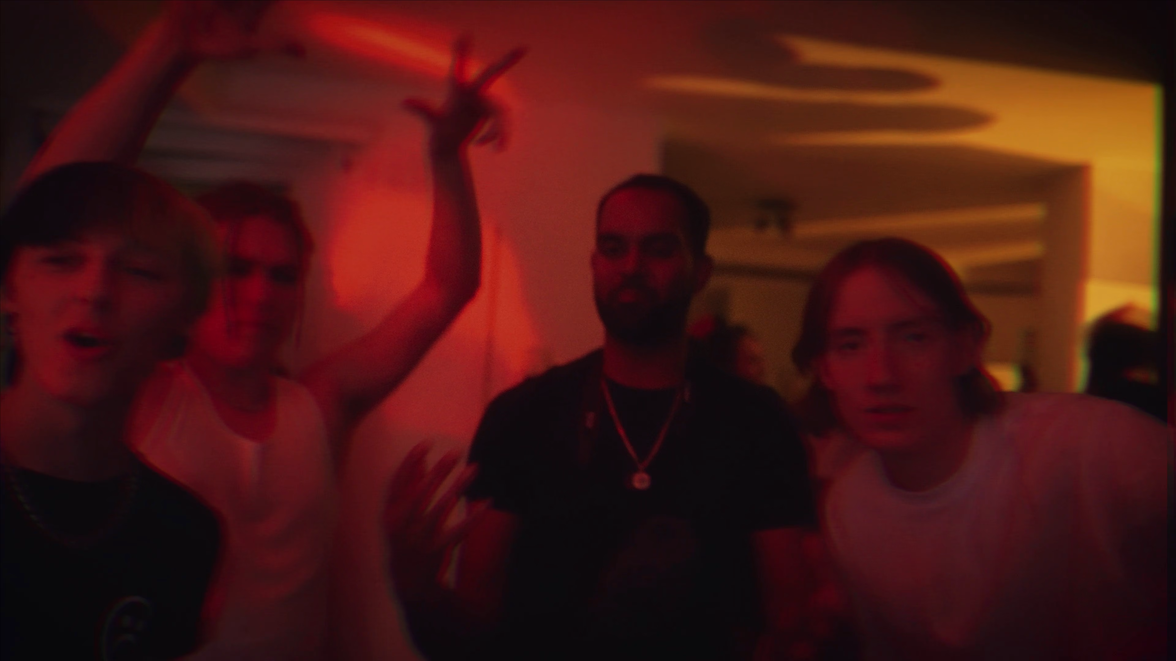 Red-lit party guests captured for the short-form film