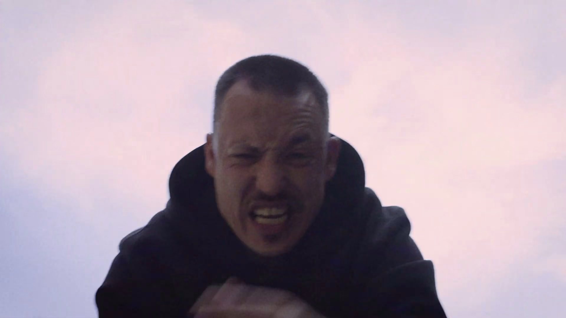Extreme low-angle portrait from the roadside sequence