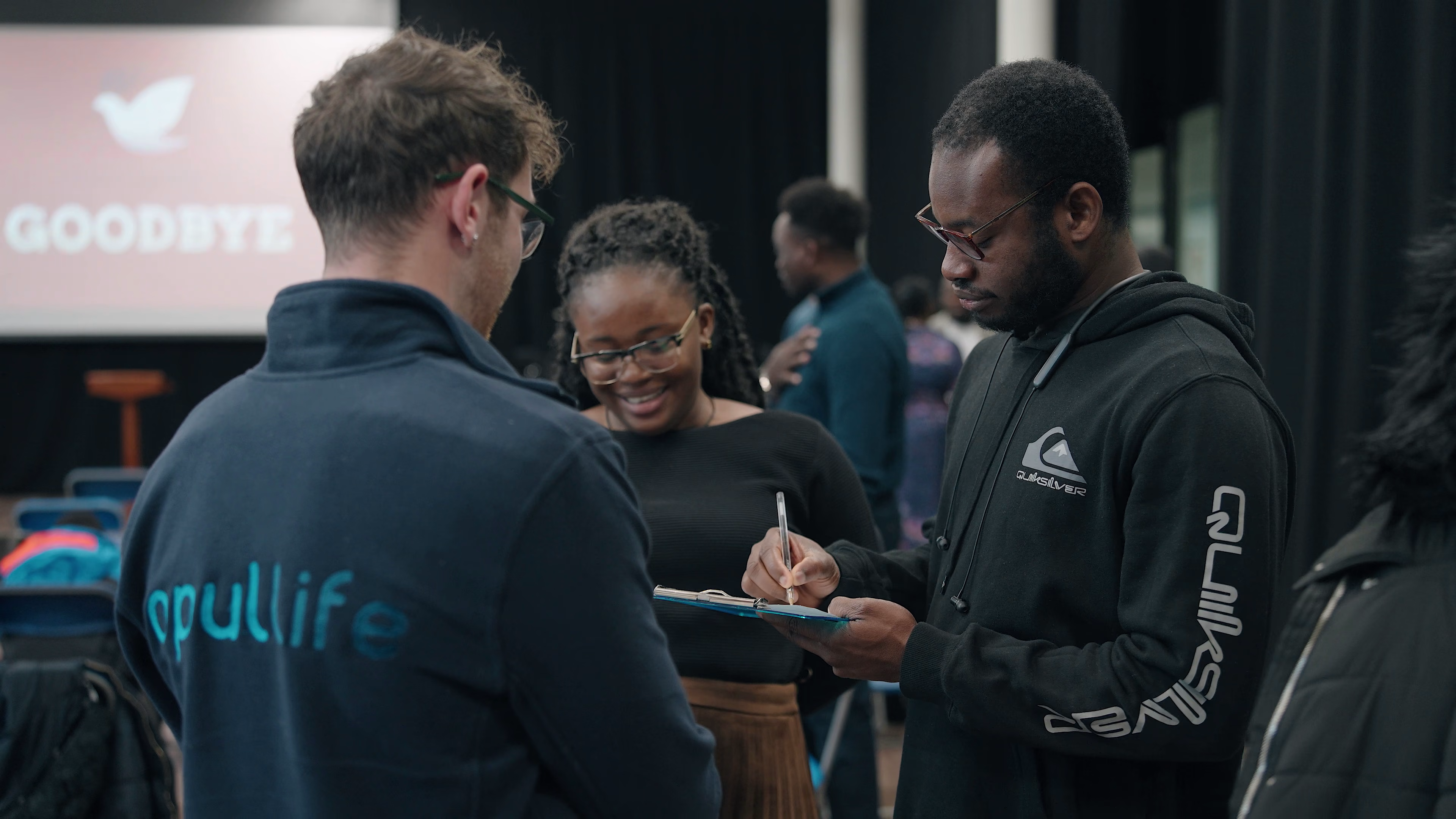Opul Life team talking with a community member during outreach in Essex