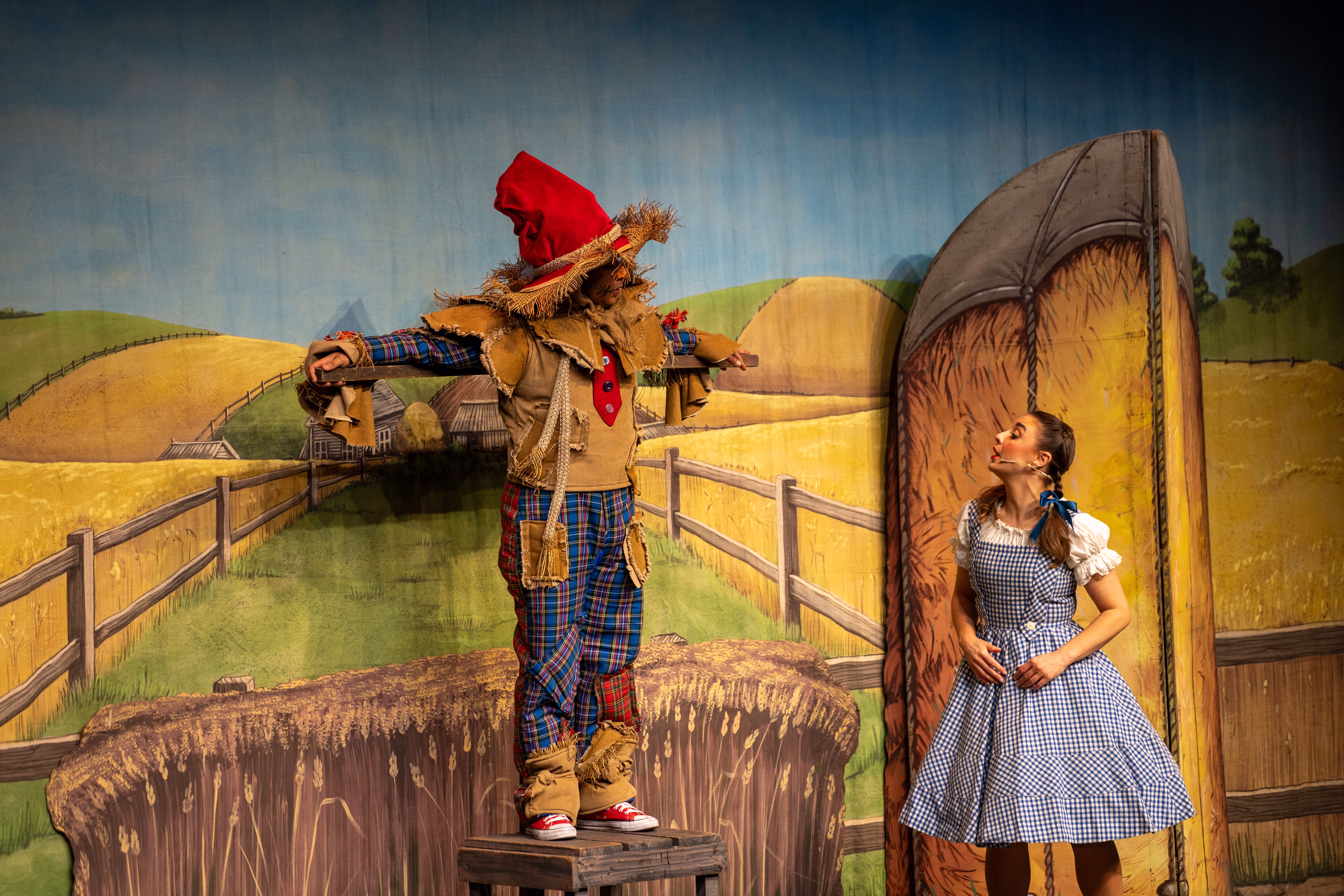 Dorothy and the Scarecrow performing in The Wizard of Oz