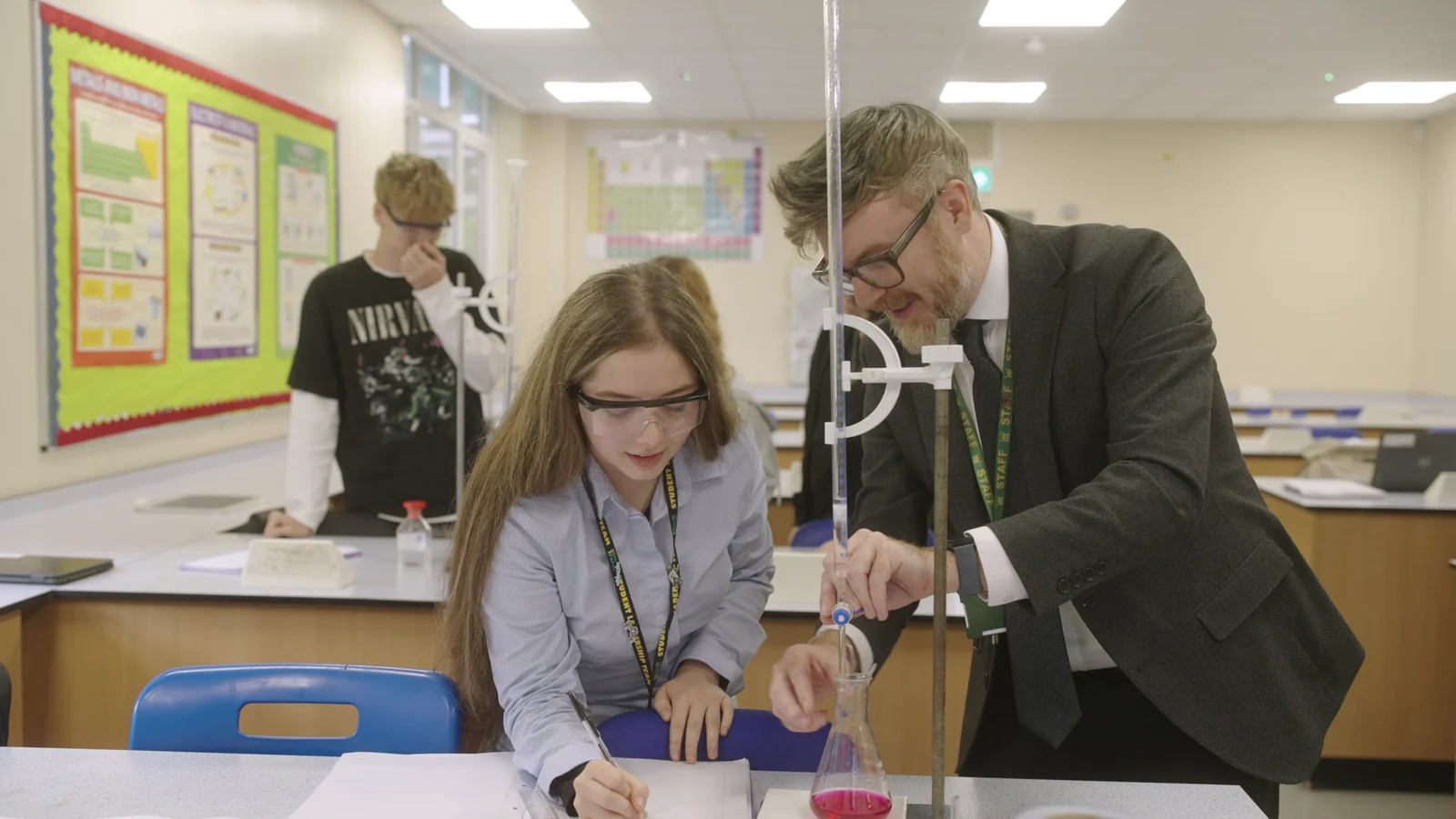 A King Edmund School student and teacher carrying out a chemistry experiment