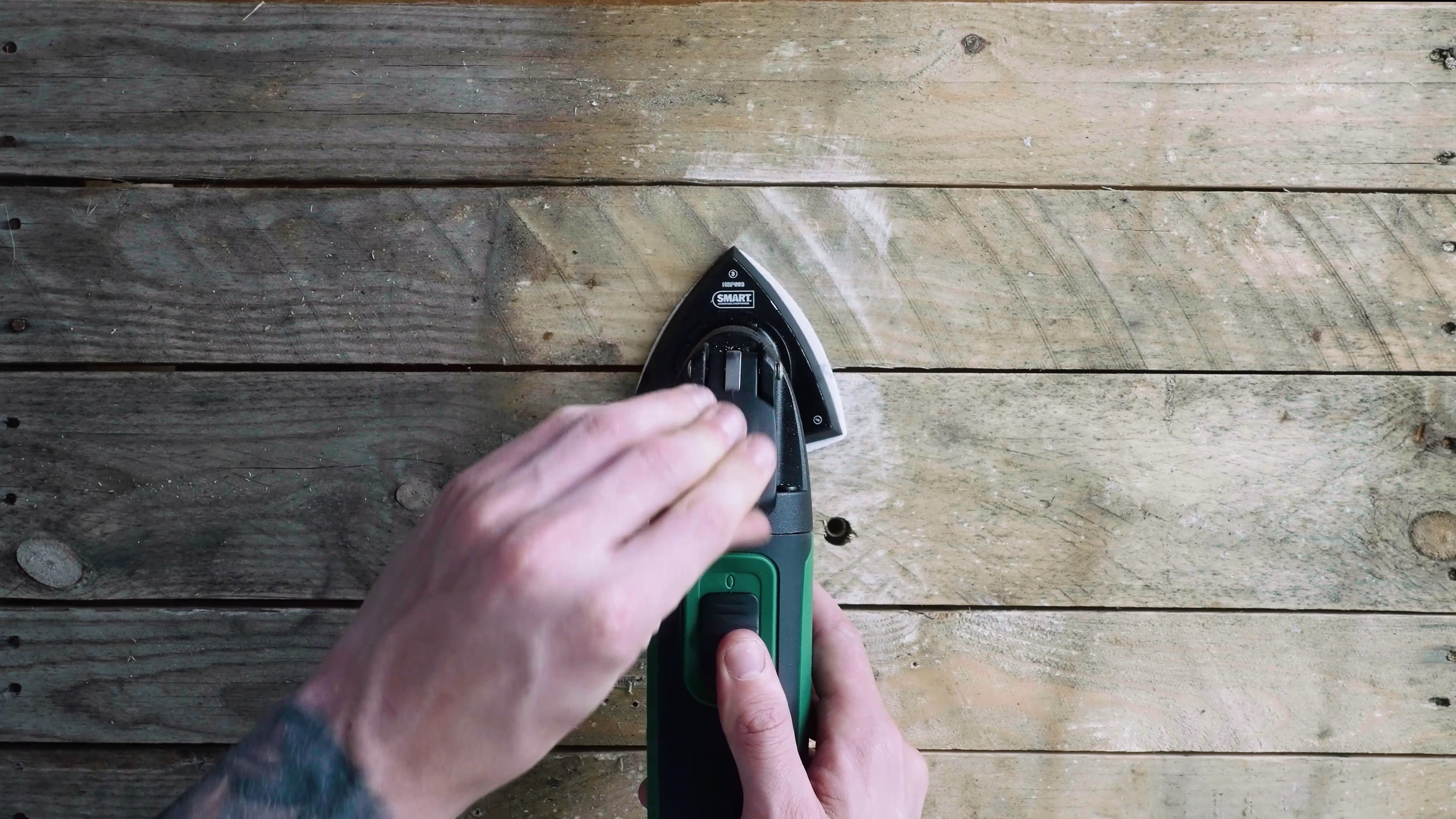 Top-down practical filming of SMART multi-tool on a timber surface