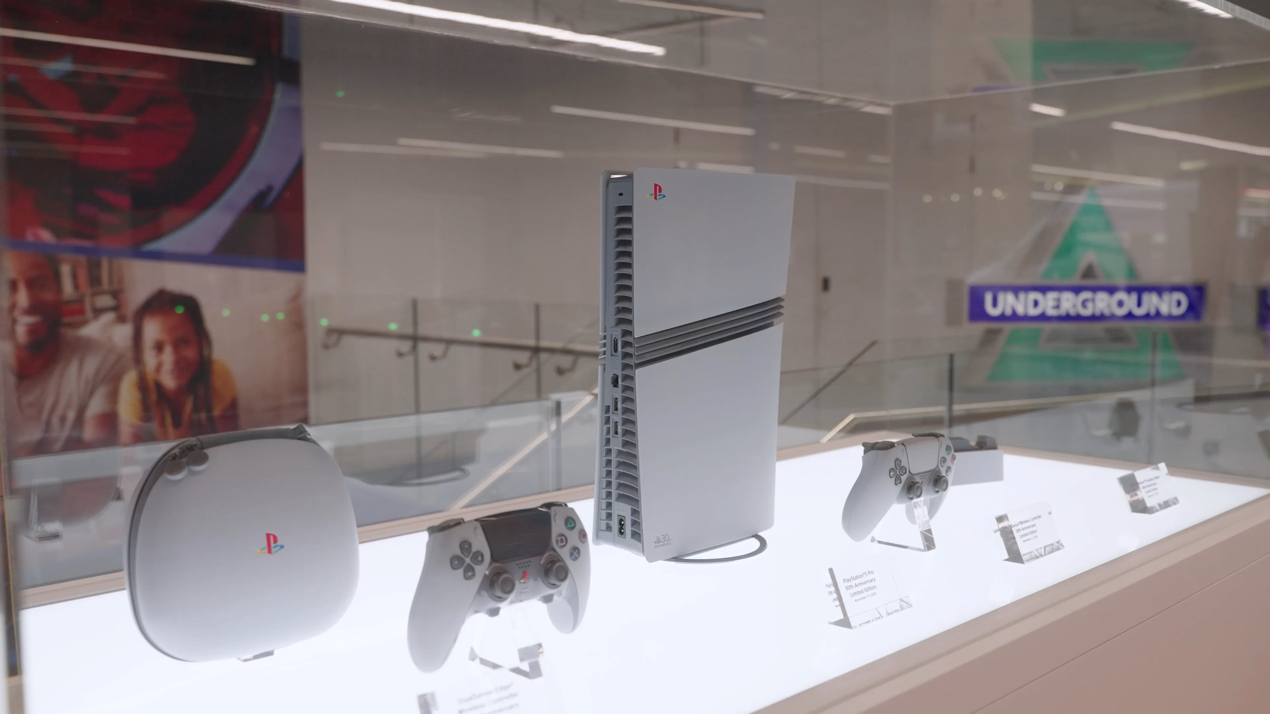 PlayStation consoles and controllers displayed at Sony headquarters