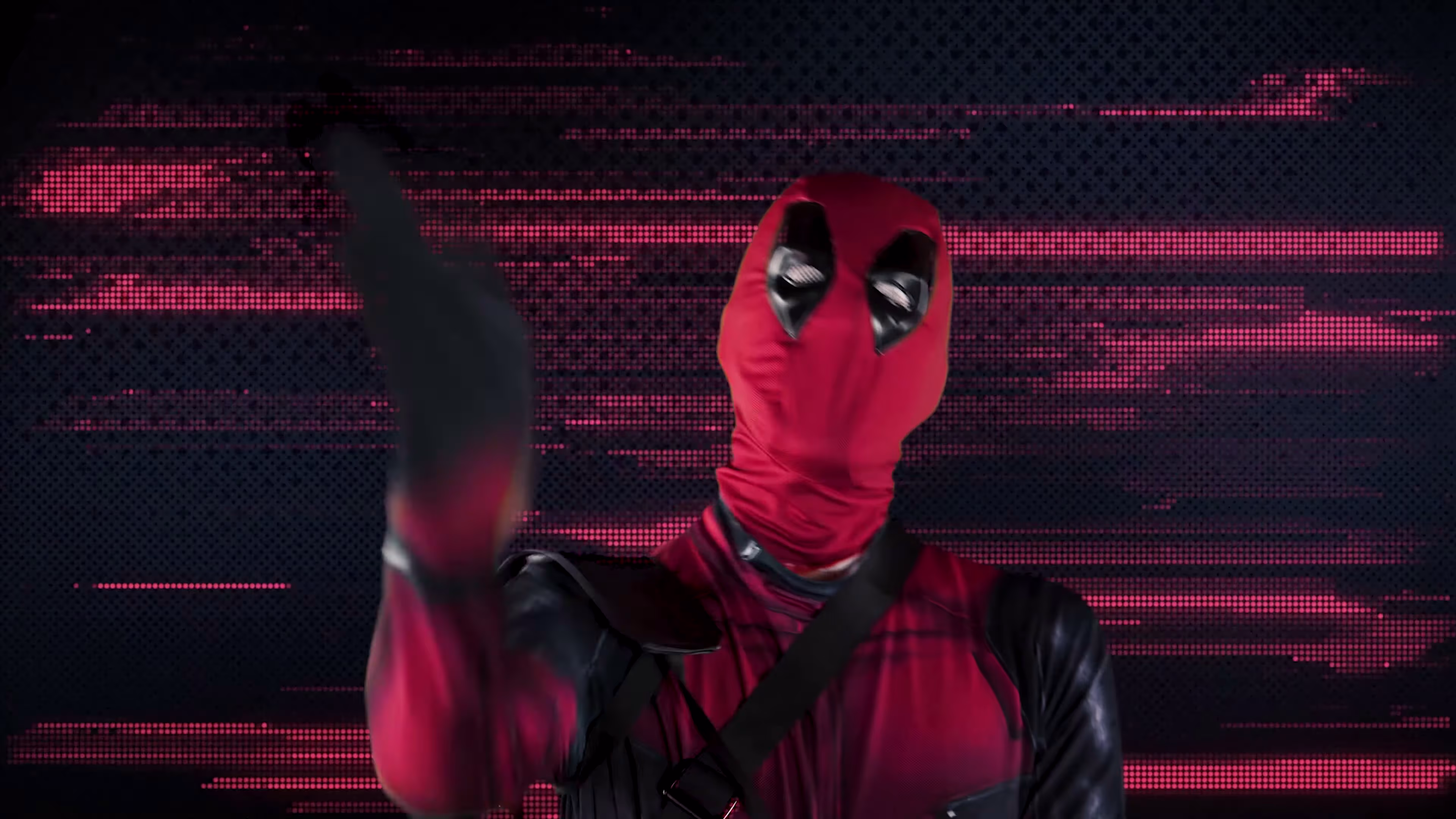 Deadpool’s raised hand against a red horizontal glitch background