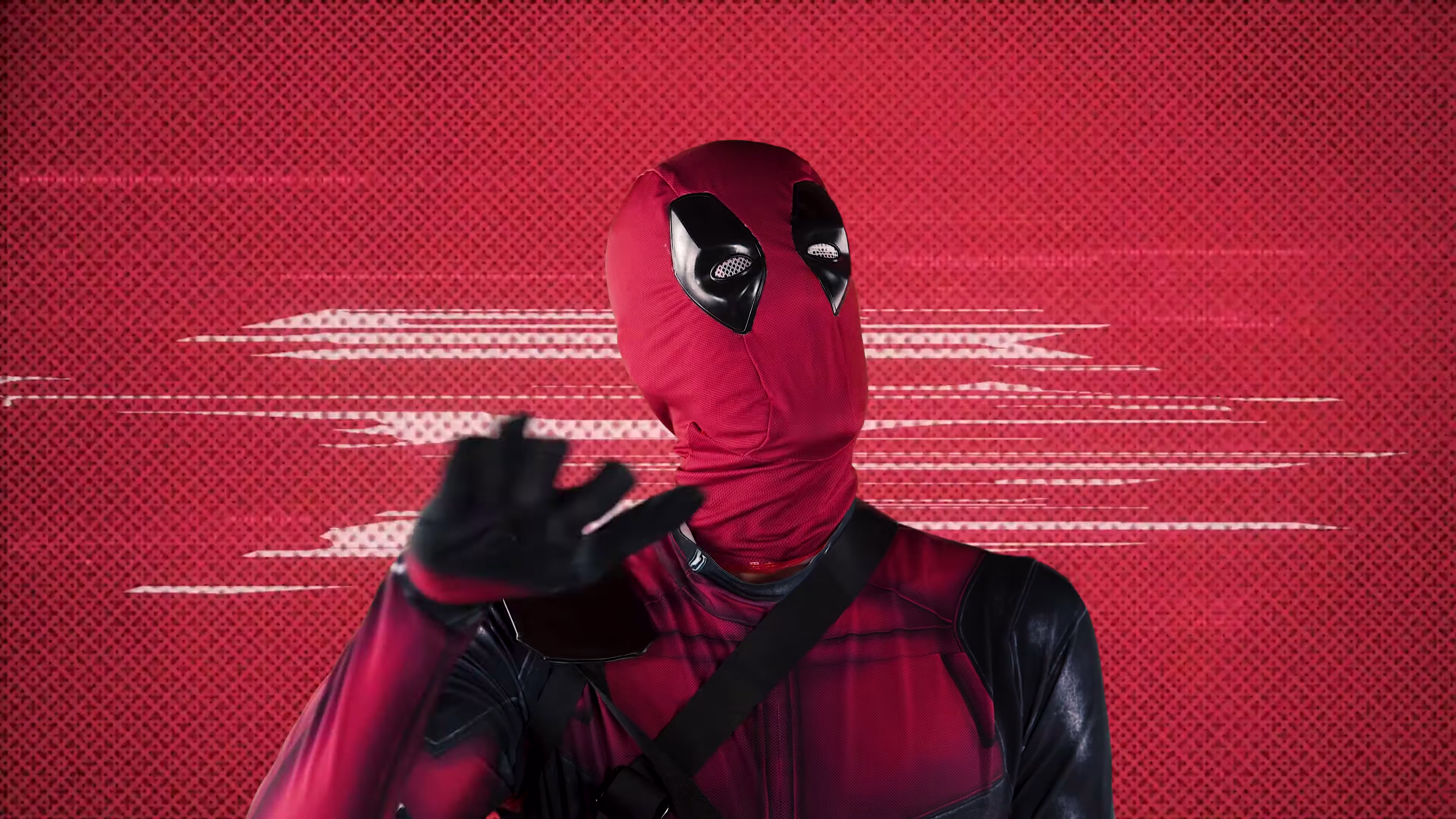 Deadpool performing against red halftone texture and white speed lines