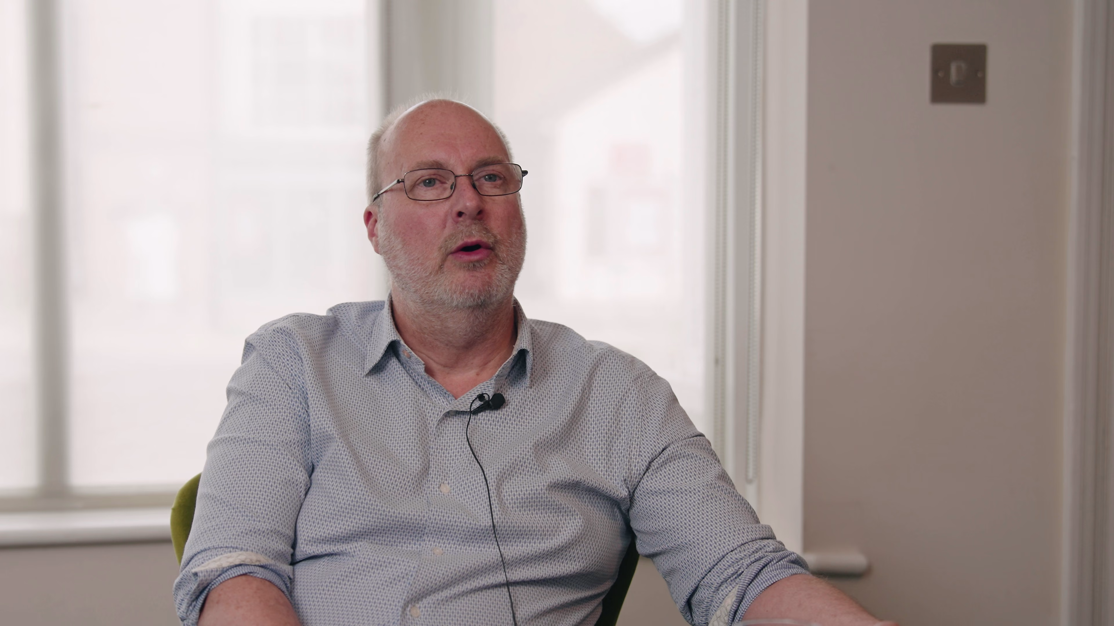 Care-sector participant speaking in a standalone testimonial interview
