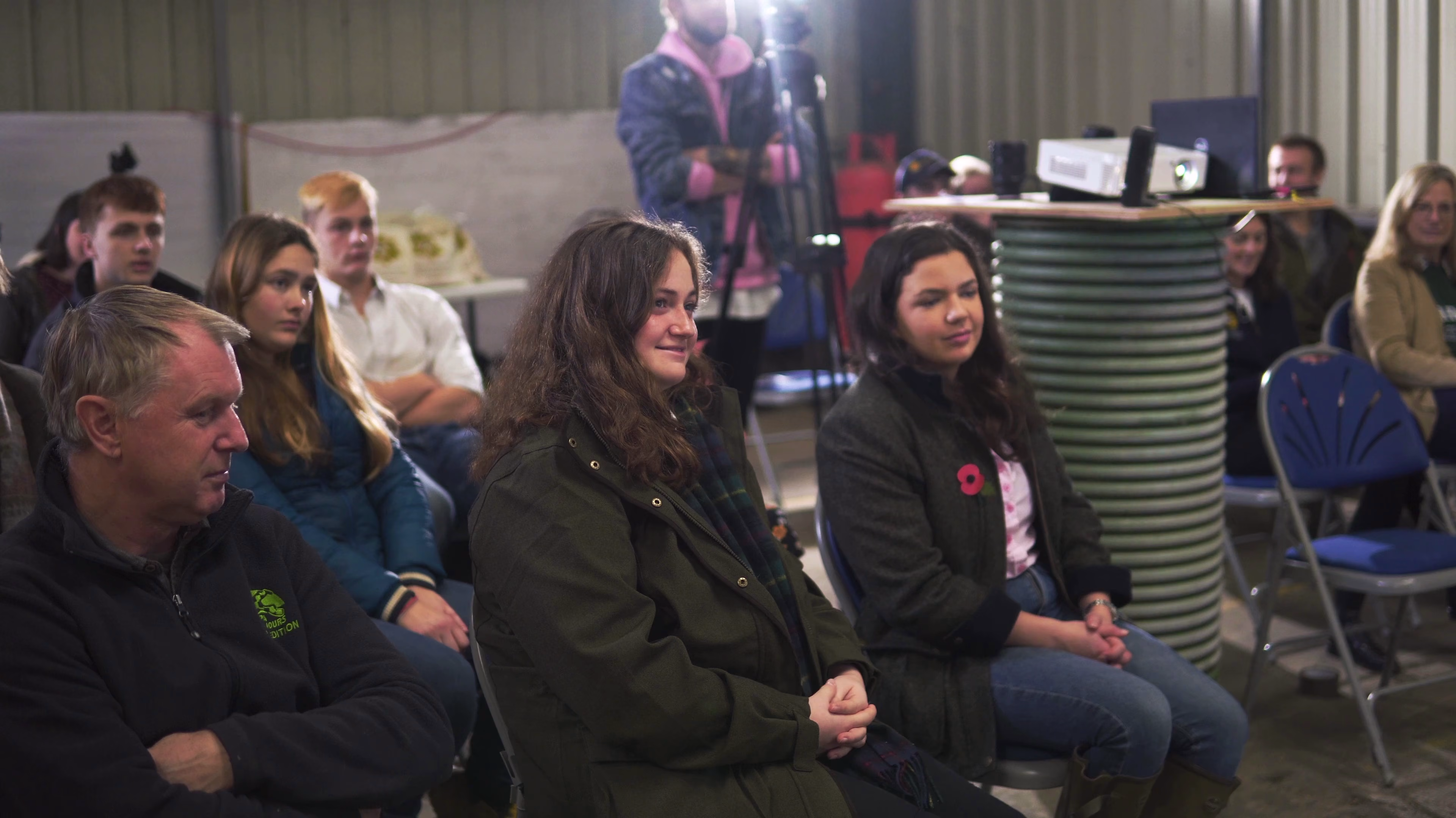 Bursary recipients and guests listening to a presentation