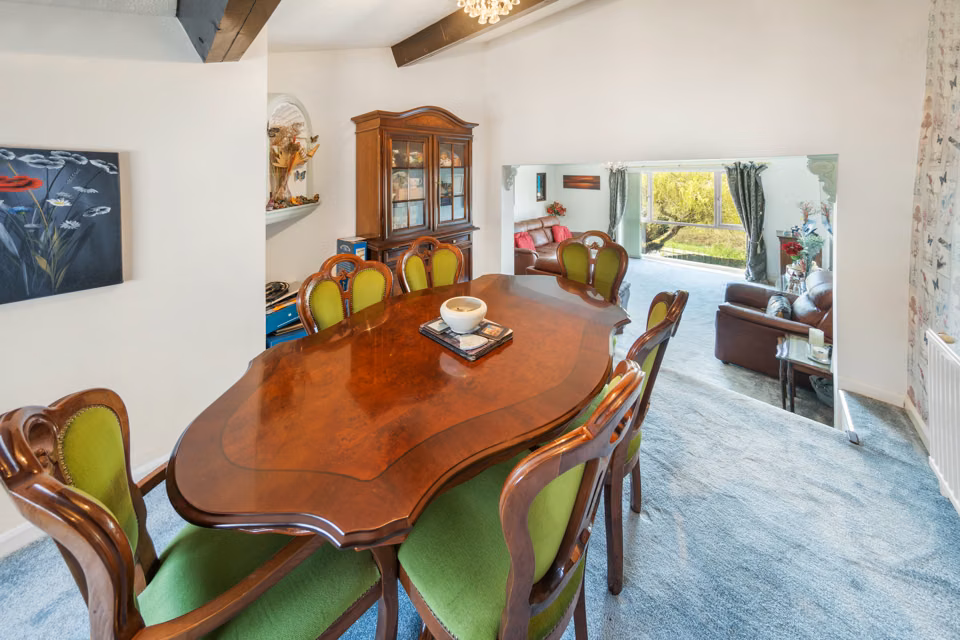 Dining table looking through into the living room — 13 Furness Close