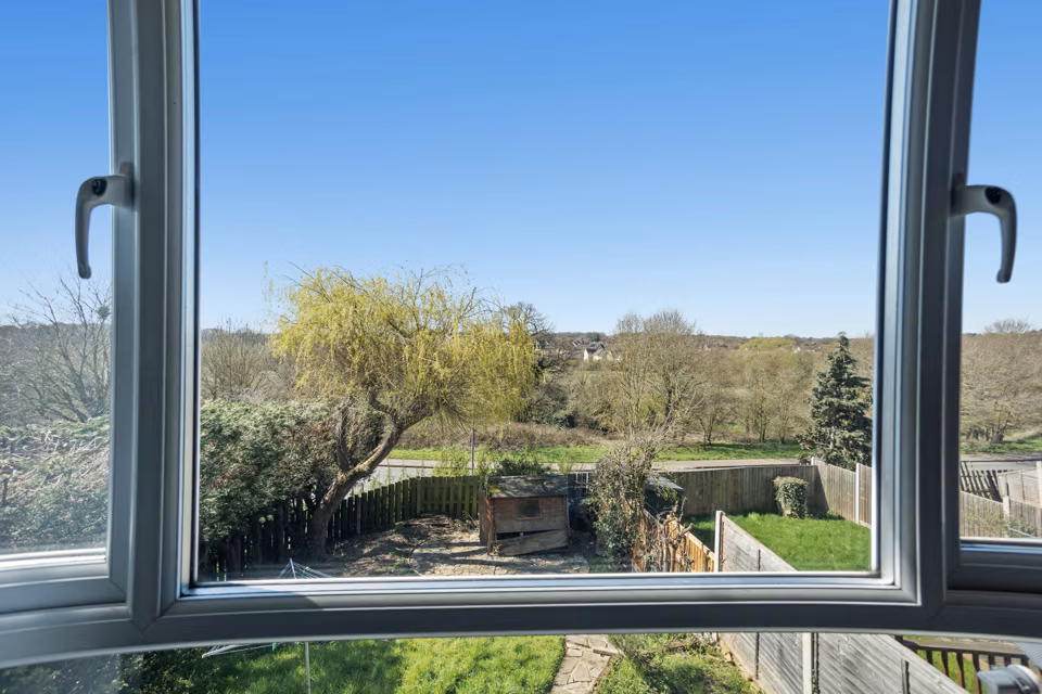 Garden view through an open window — 13 Furness Close