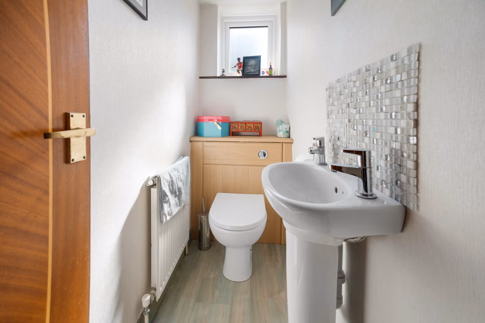 Small cloakroom with basin and toilet — 13 Furness Close