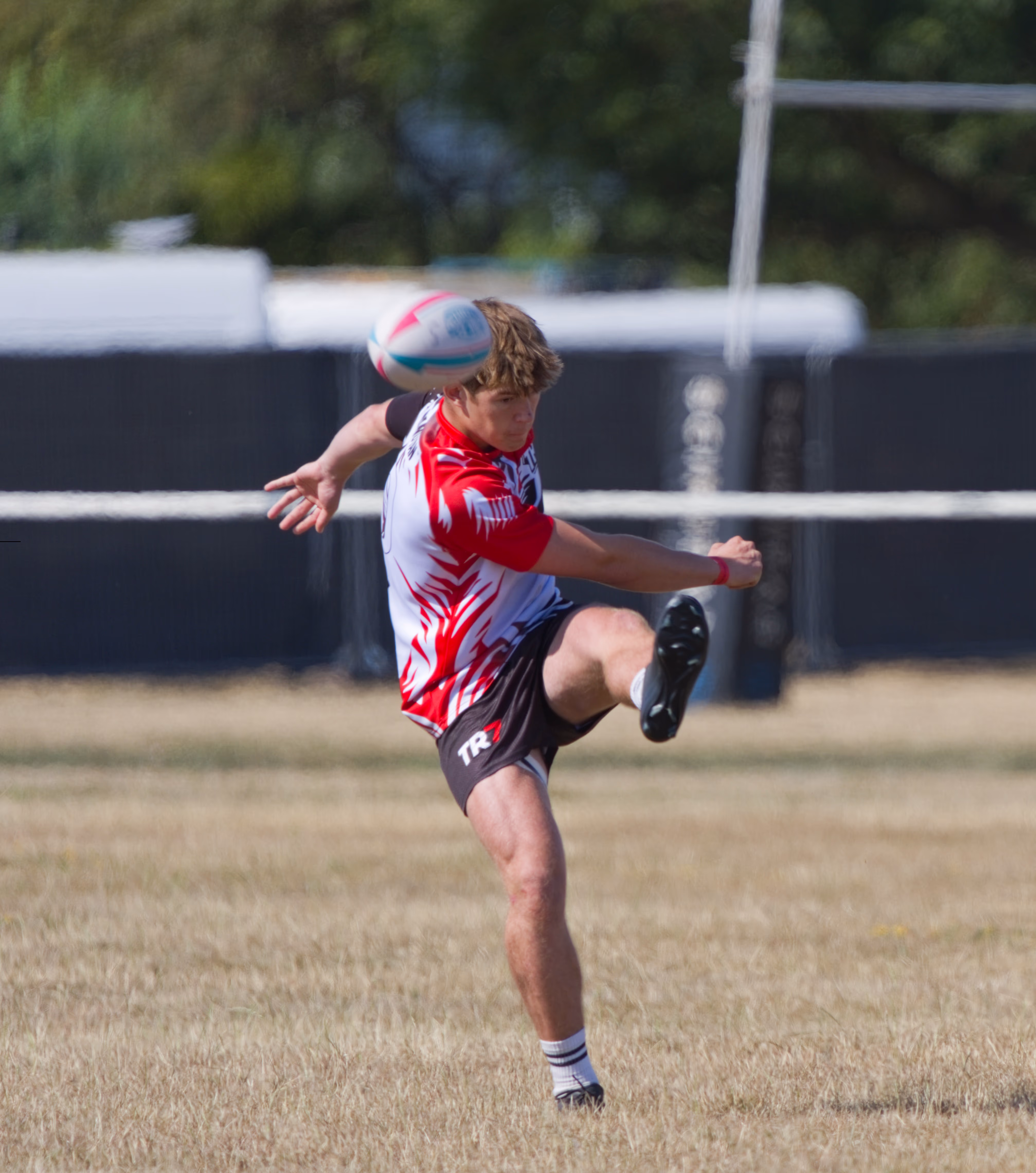 TR7 player kicking a rugby ball during the Cheltenham tournament
