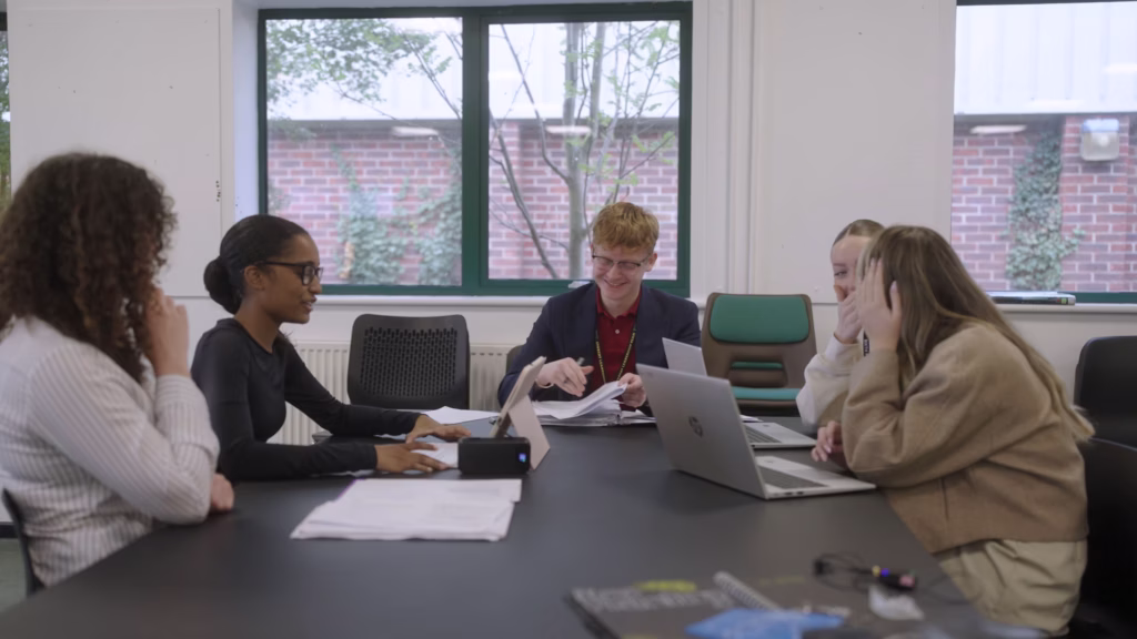 King Edmund Sixth Form students working together around a classroom table