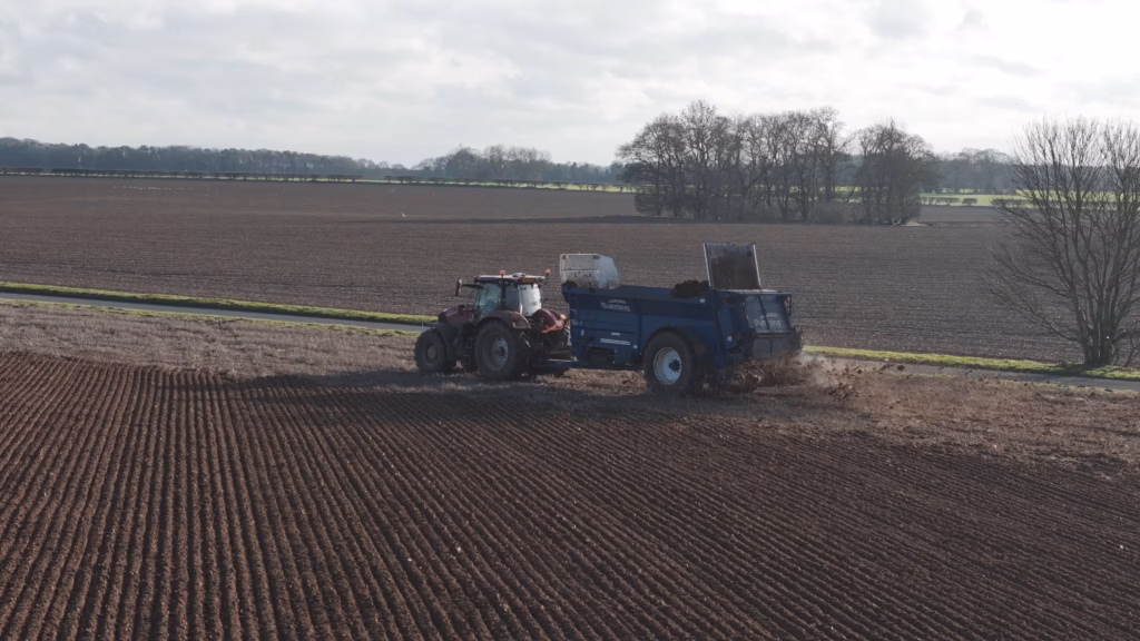 Hands holding seed during Sentry agricultural filming